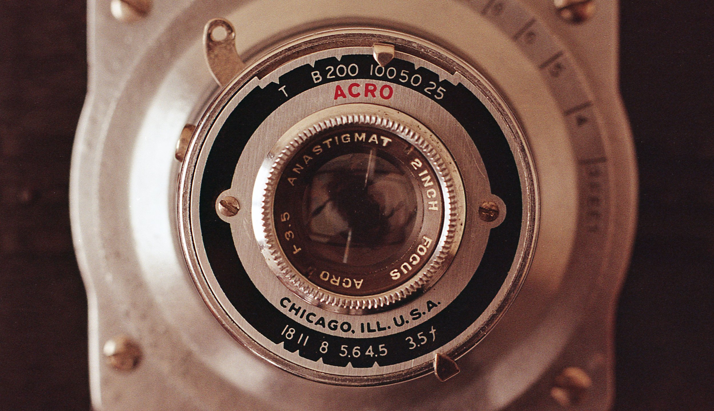 Close up of 8mm film projector changing the focus point between