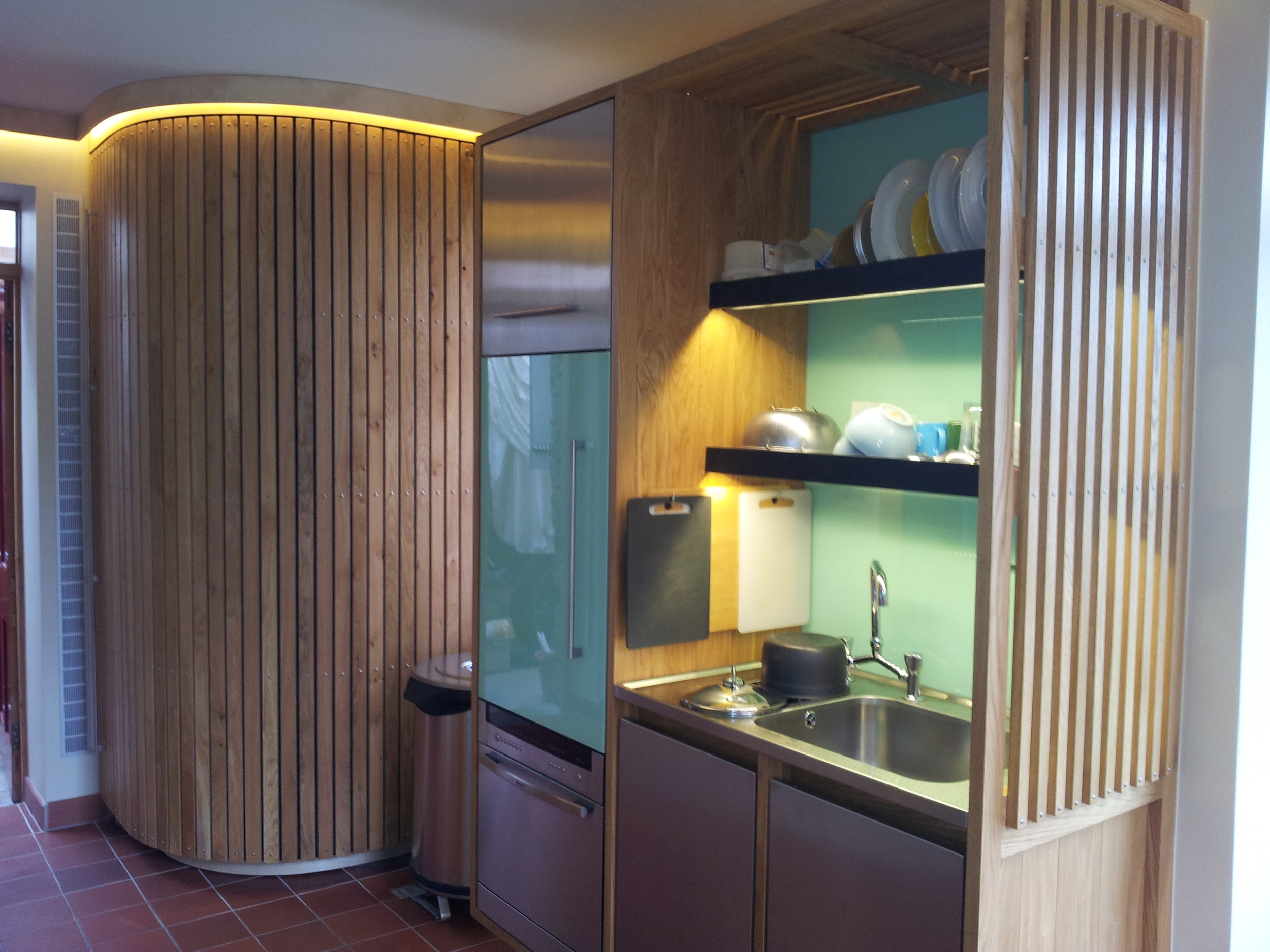 Designer Kitchen curvy cupboard and slate shelves.jpg