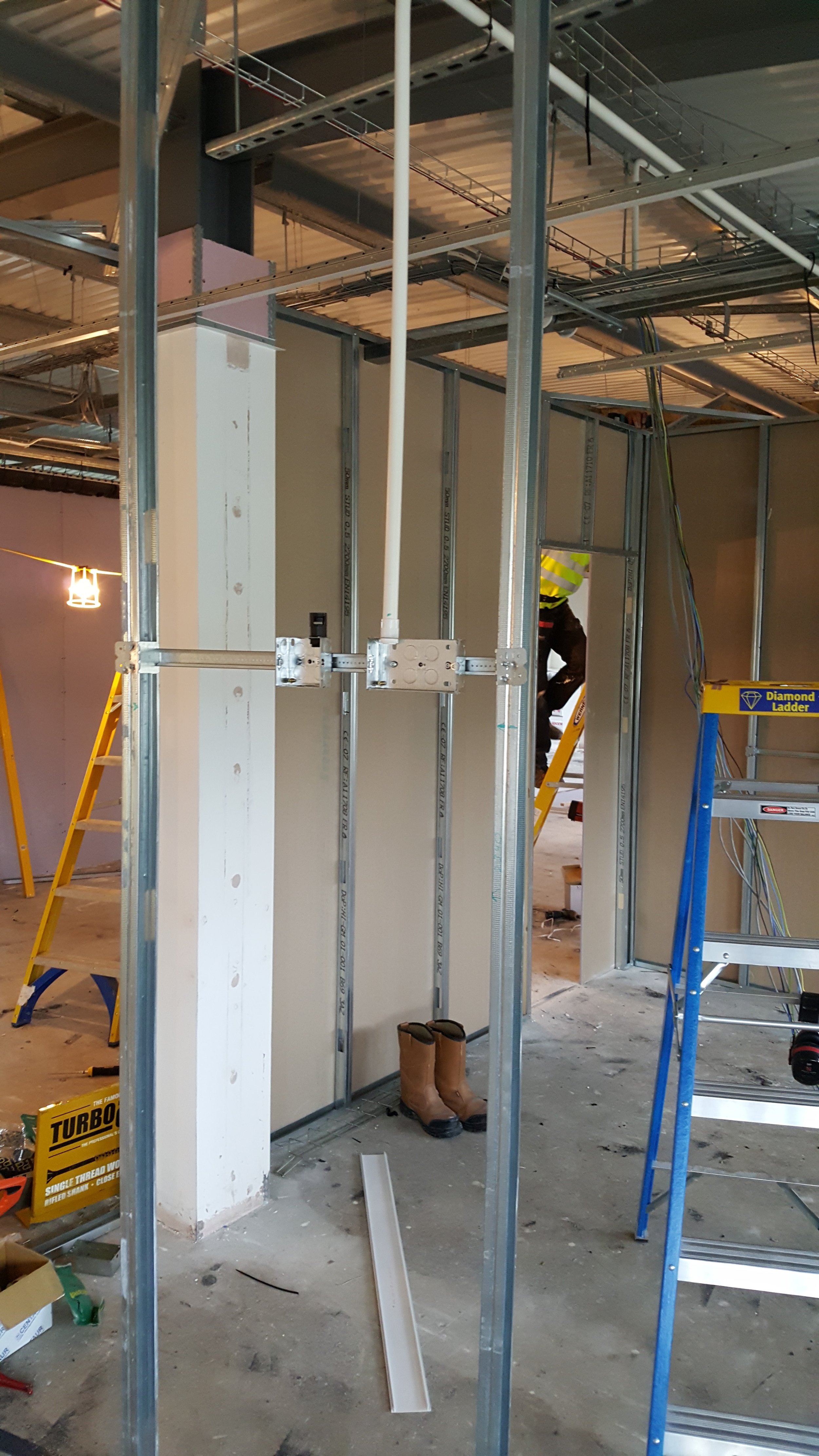 First fix wiring in metal stud partition walls