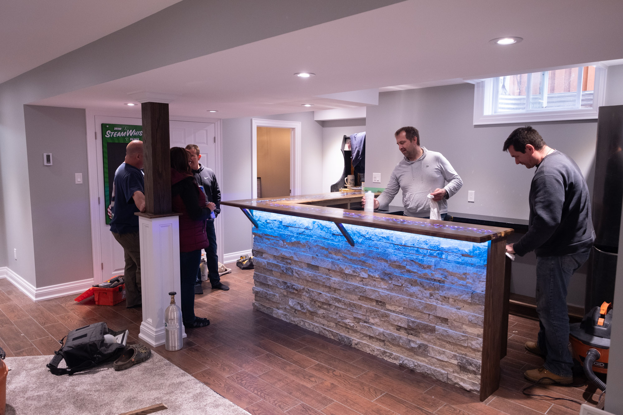 Custom epoxy bar top in basement renovation in Acton