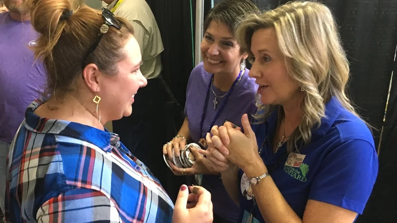 Piccione Vineyard's tasting room manager, Hailey Klepcyk (left) talks with Flavor, NC's Lisa Prince.