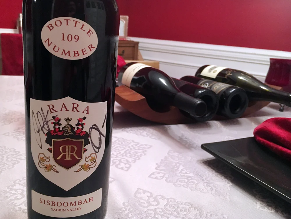 A signed bottle of the wine will find its way to Triangle Around Town's wine cellar.