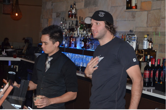 Former Carolina Hurricane Bates Battaglia working behind the bar