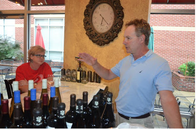 Uncorked's Owner Tony Fox gives details about the French wines being poured that evening. Photo by Dathan Kazsuk