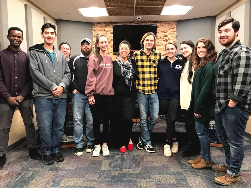 Shown here with artist Sarah Scharbrough McLaughlin and several Butler University students