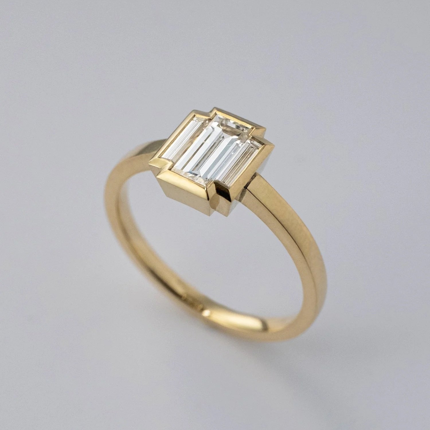 Engagement ring made by hand by goldsmith Julia Bocanet, with gold and natural baguette diamonds.