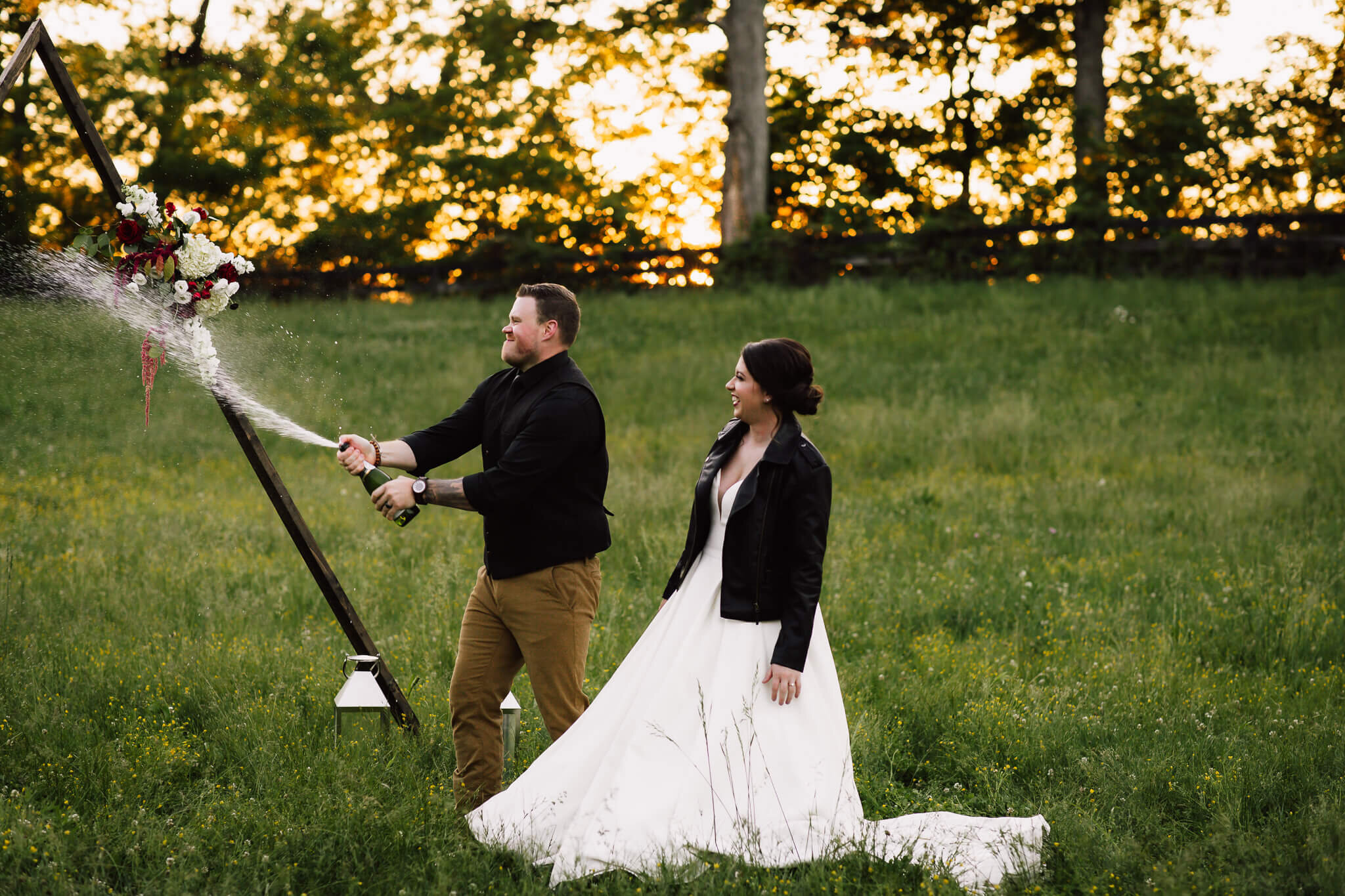 groom-champaign-toss-wildflower-elopement.jpg