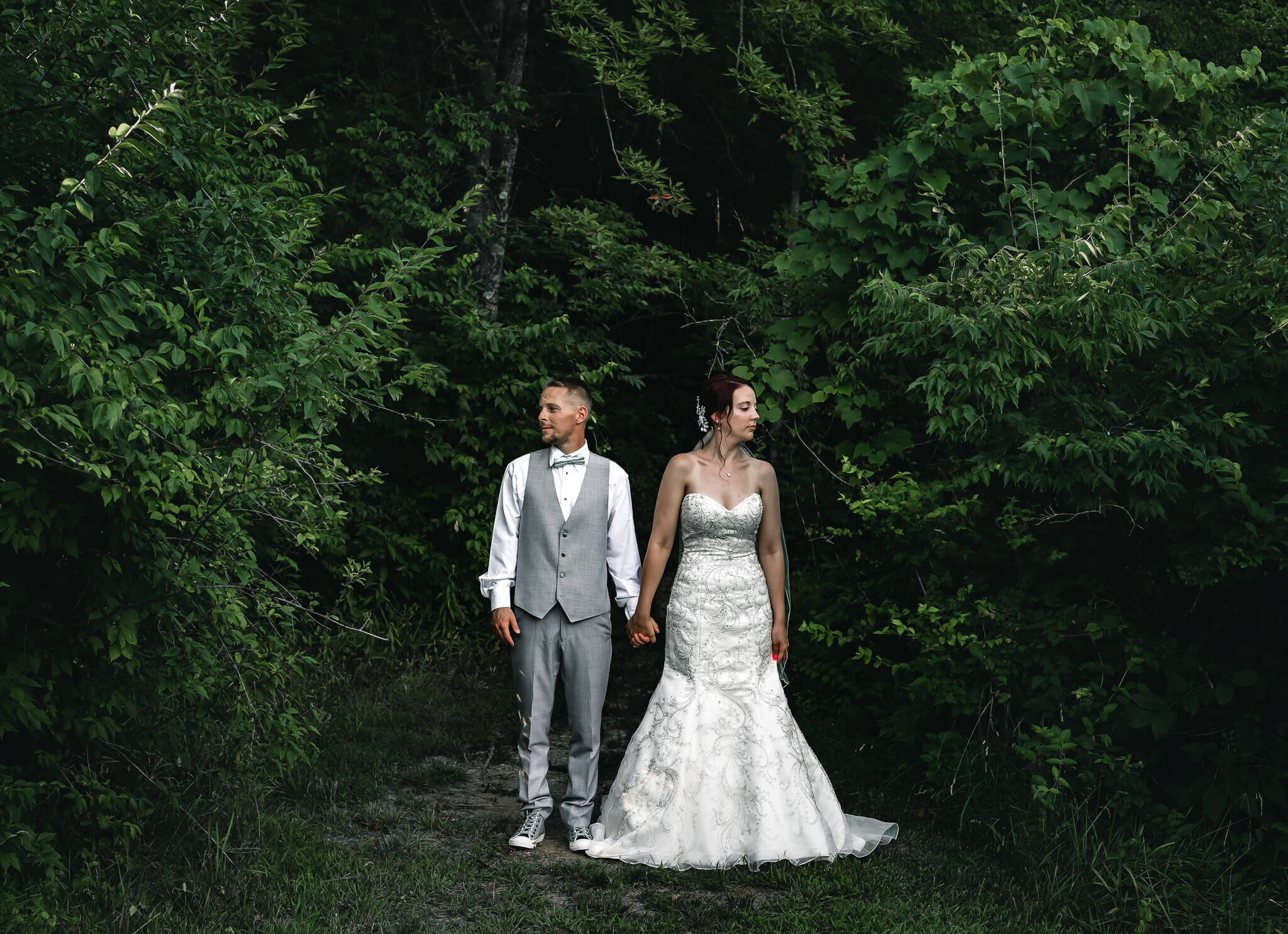 retro-bride-groom-poses-woods.jpg