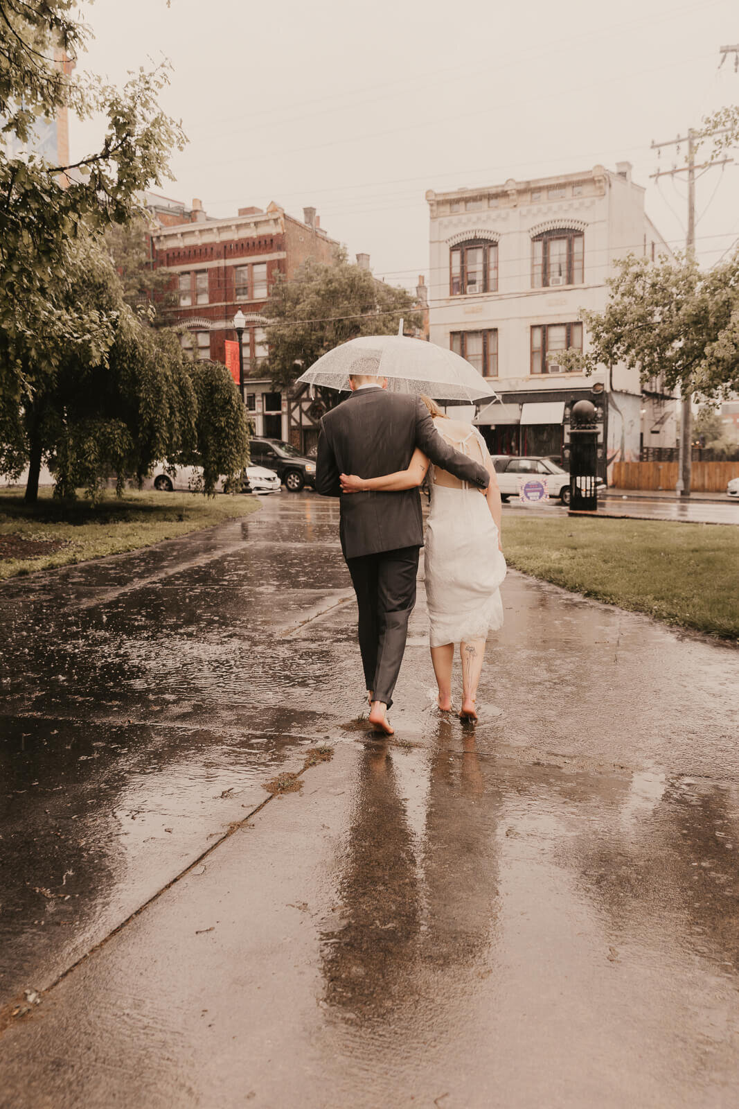 barefoot-bride-groom-rainy-wedding.jpg