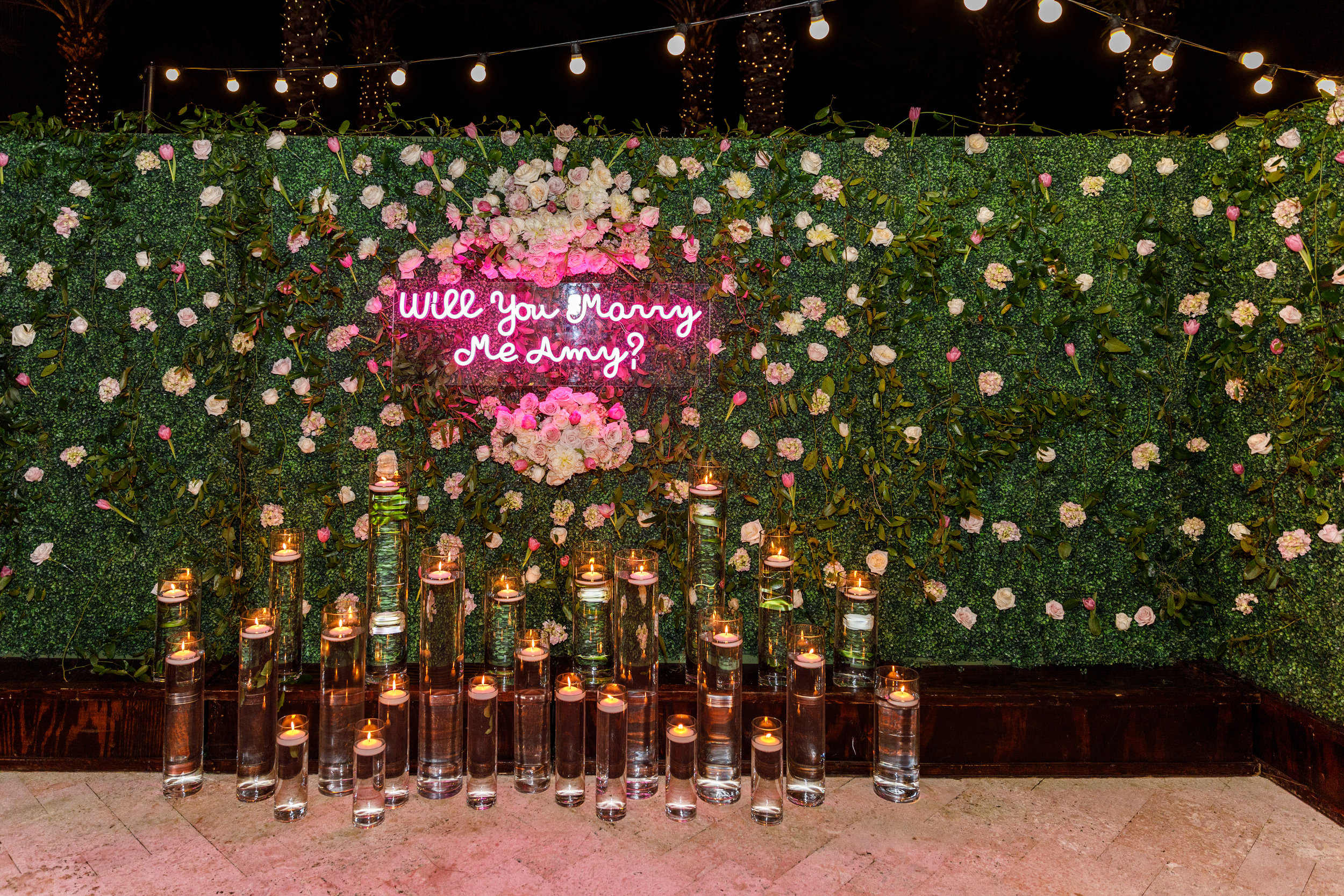 Dream Wedding Proposal planned by Whitney Carillon Events with Neon Sign and pink flowers