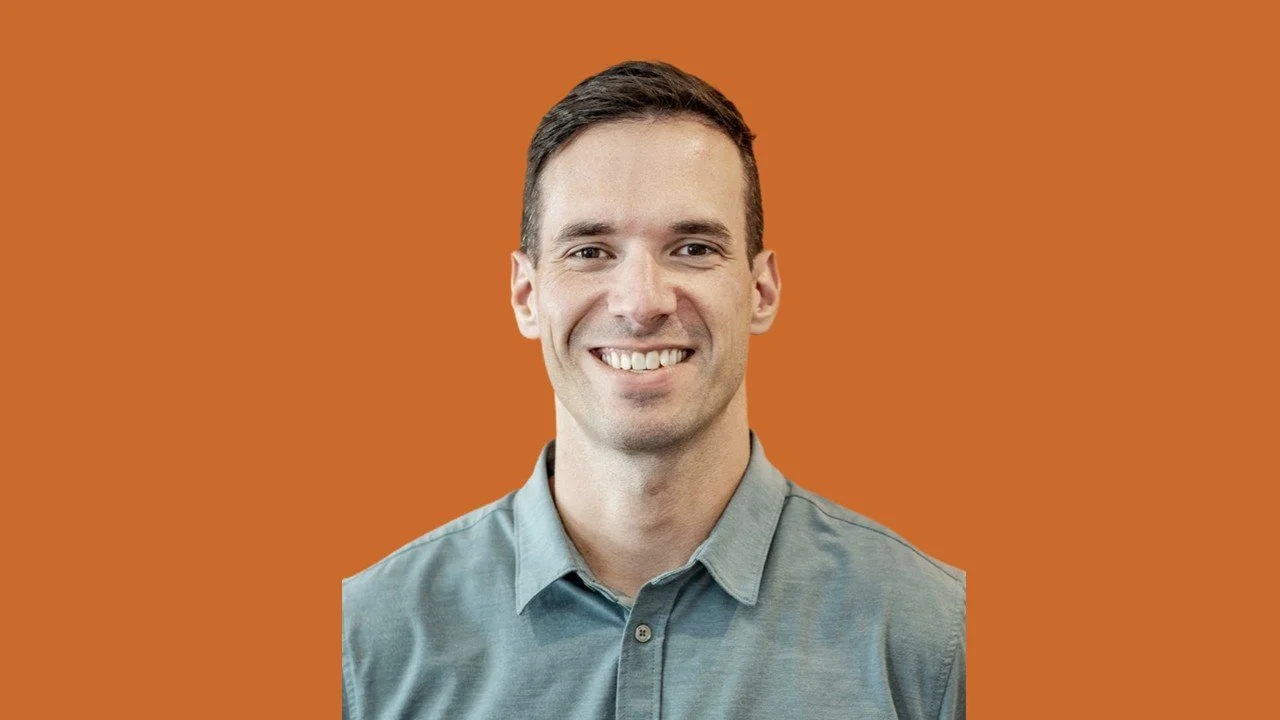 Dr. Craig Rowat, chiropractic and sports rehab specialist at Spine and Sport Bermuda, smiling in a professional headshot.