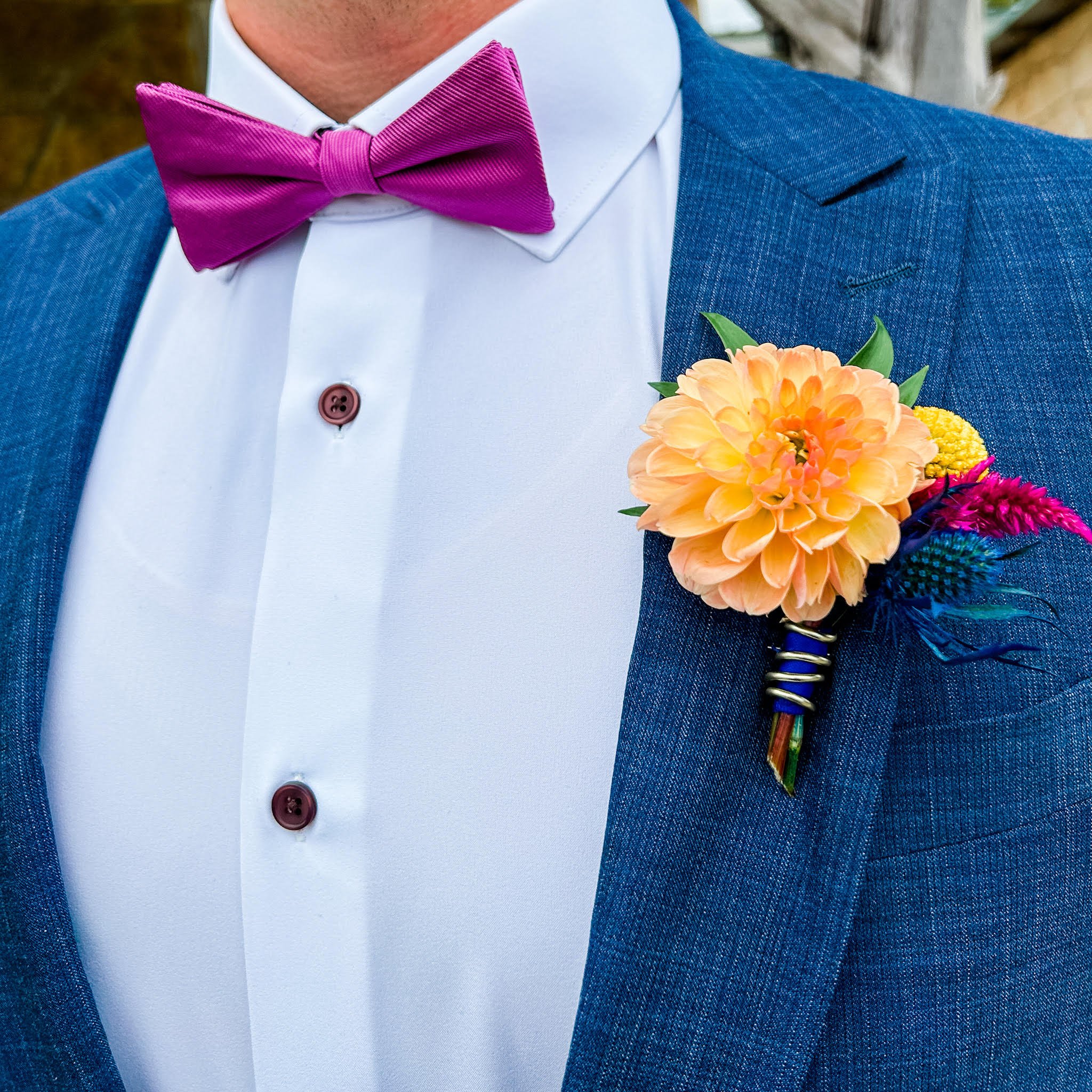 Bright Groom Boutonniere with gold wire and bright flowers at cave without a name and hotel valencia.jpg