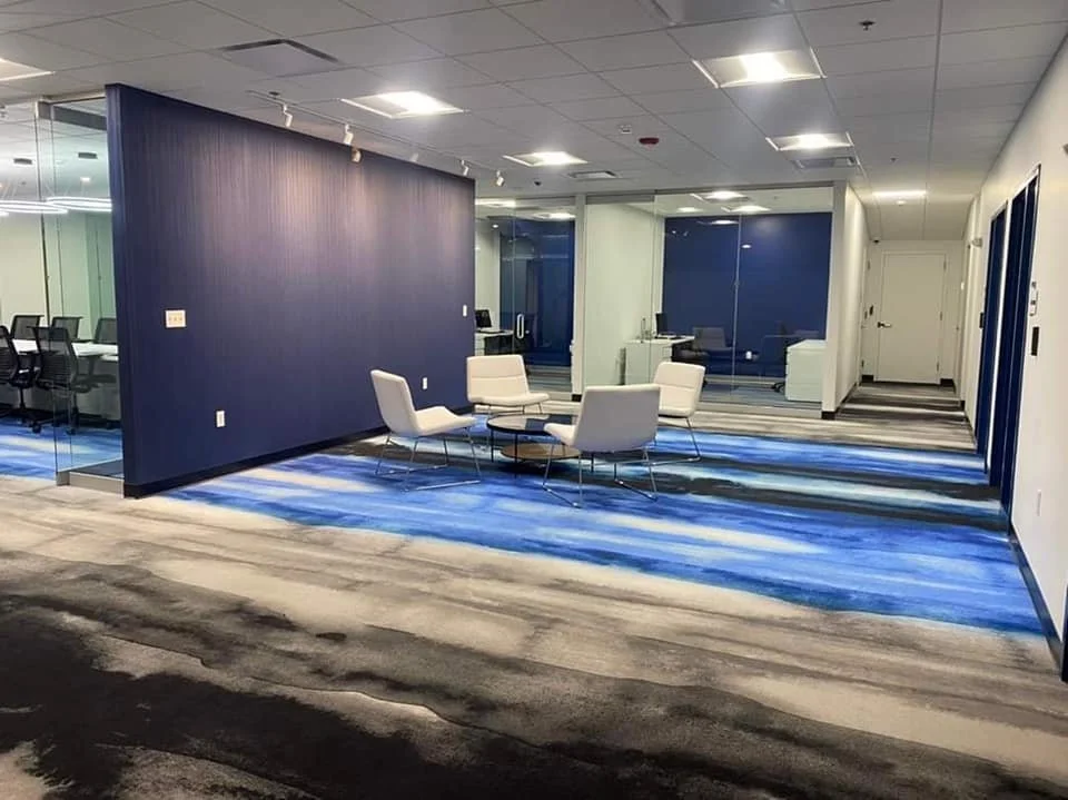 Open office area with watercolor like carpeting