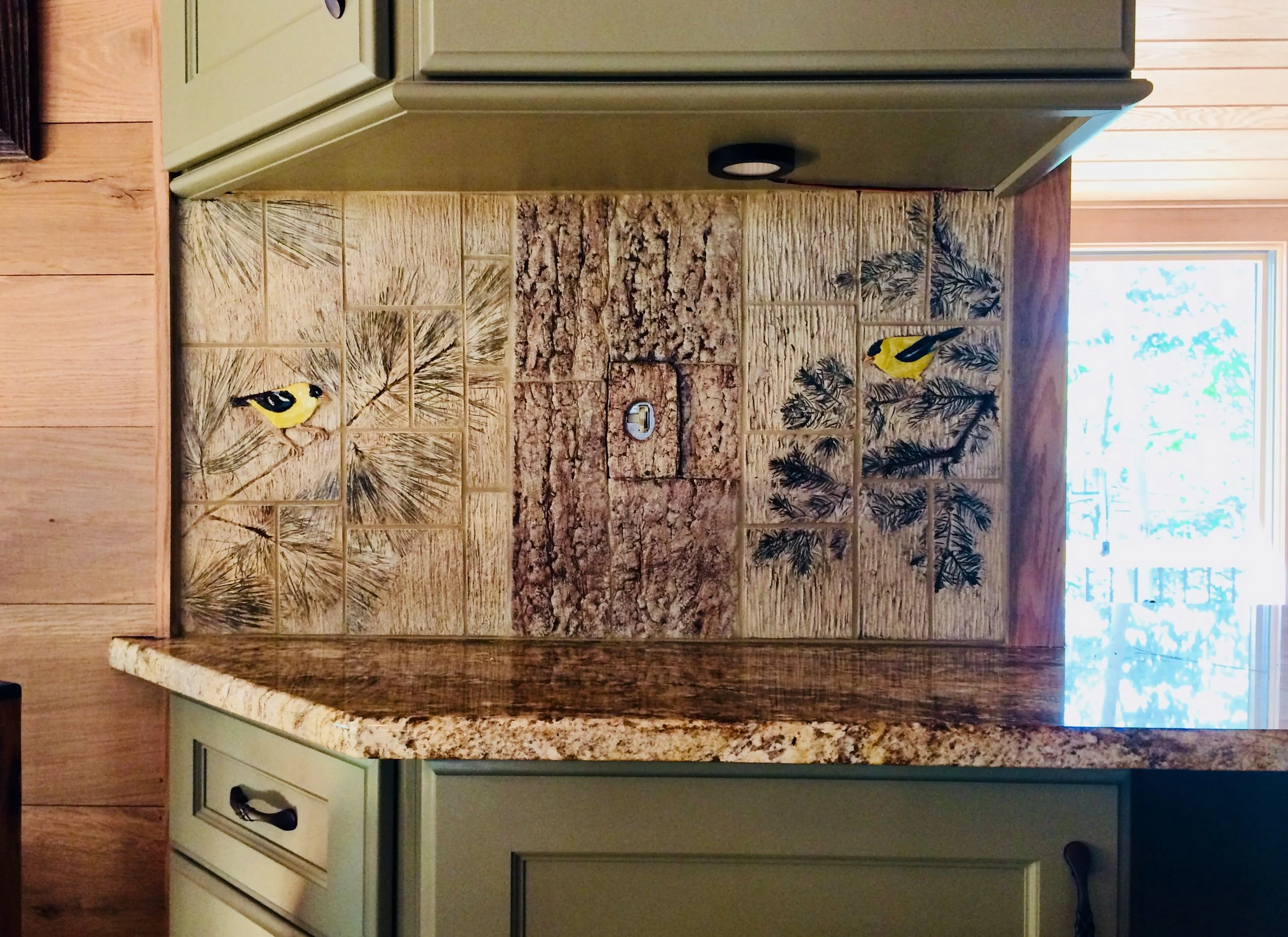 Bas-relief goldfinches and faux tree bark tile 