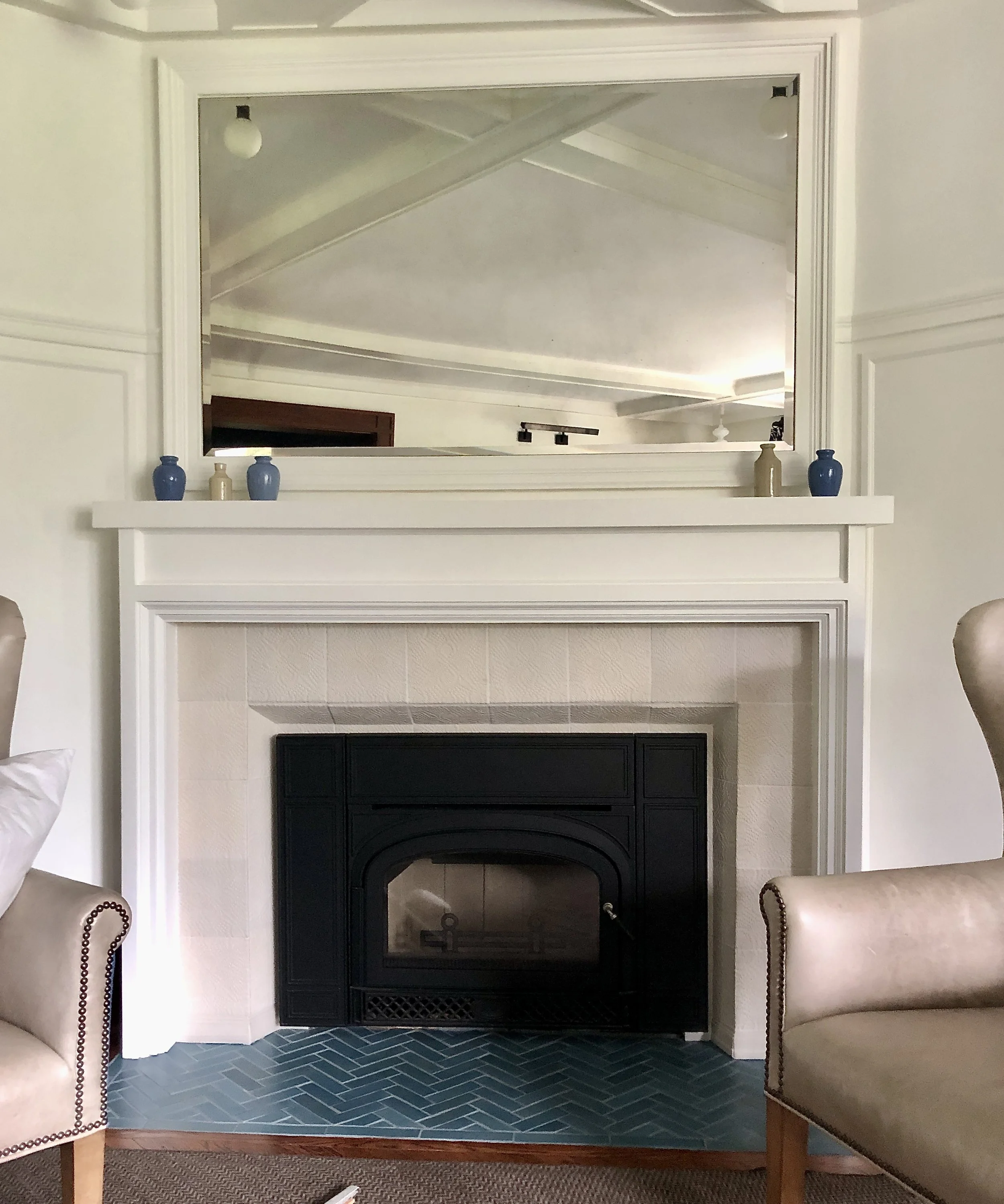 White textured fireplace, herringbone hearth