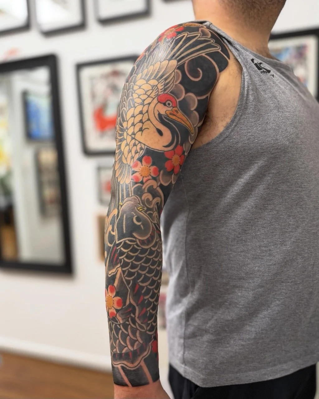 Traditional Japanese crane and koi sleeve tattoo by Horiyama in Auckland, New Zealand
