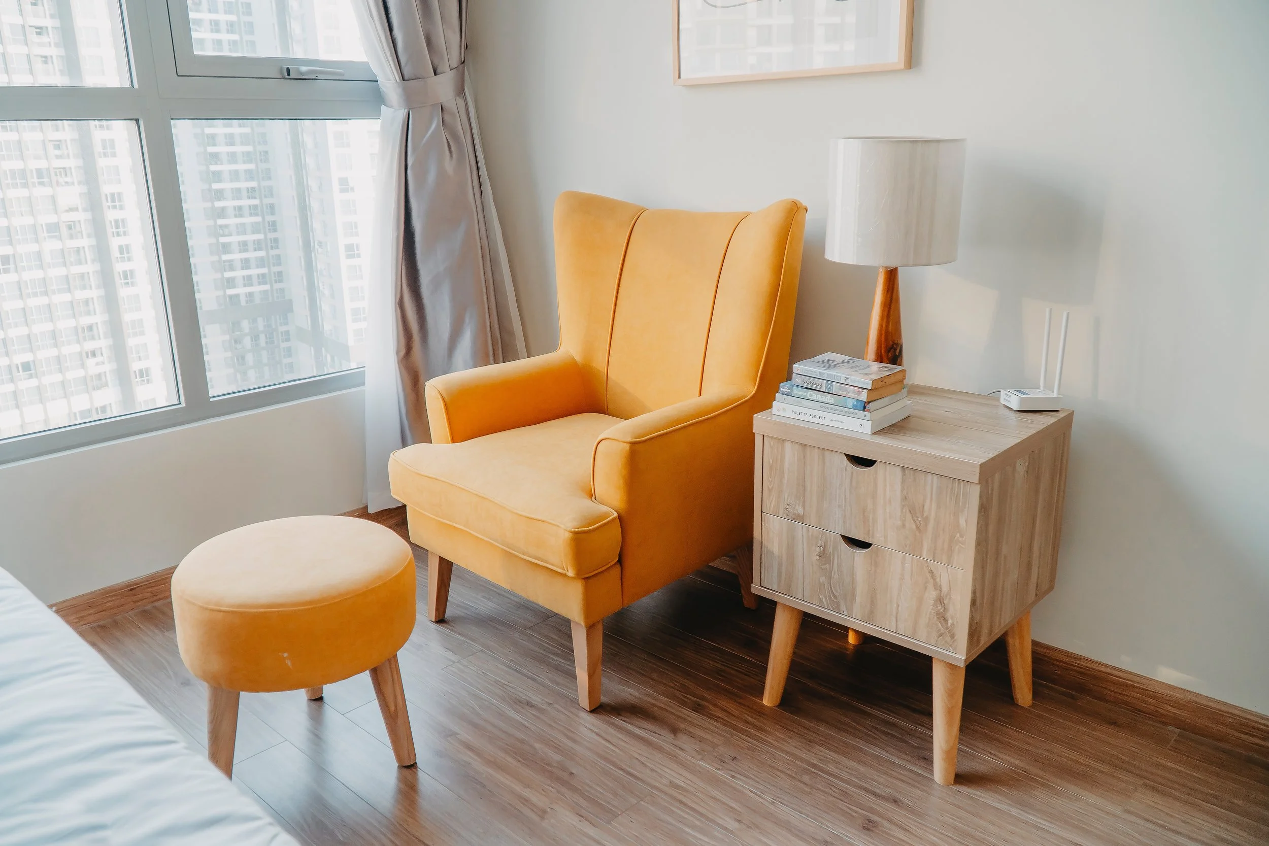 Modern bedroom space with orange armchair