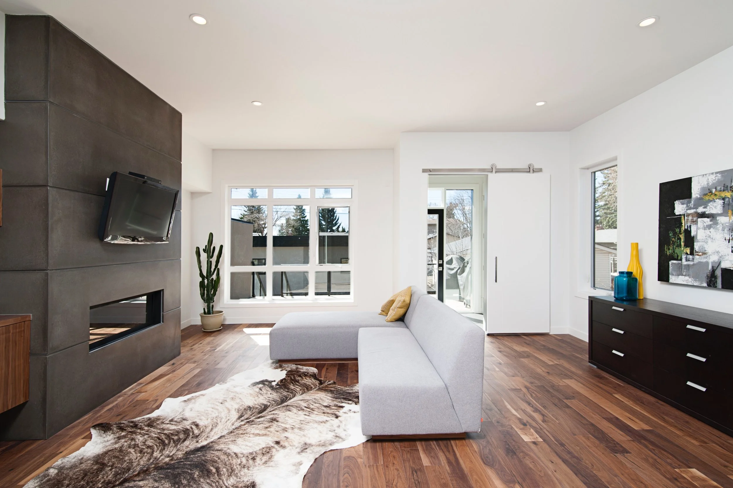 modern living room with high hat ceiling lights