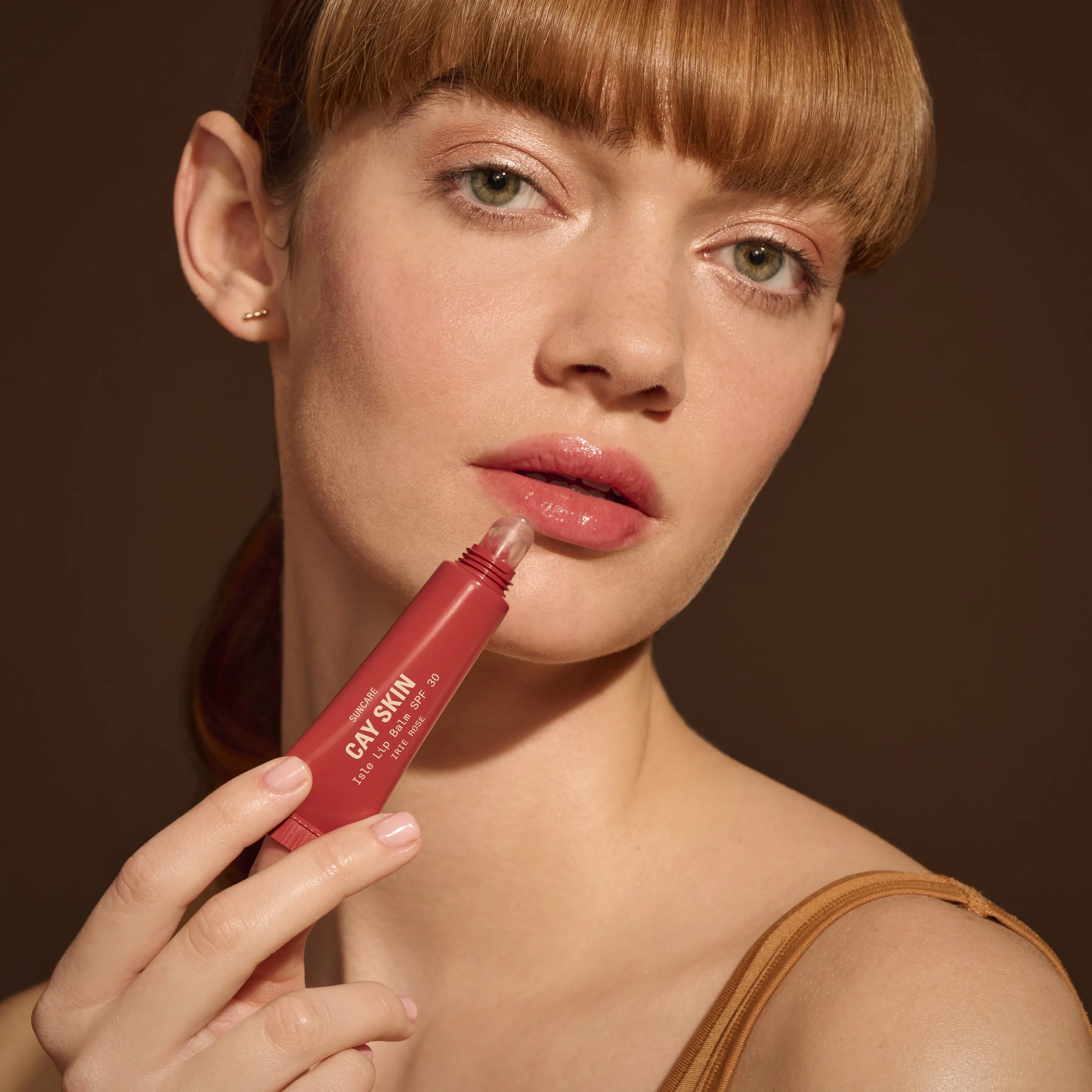 31_CaySkin_Carolyn_IsleLipBalm_IrieRose_01_1721_FINAL_SQ.jpg