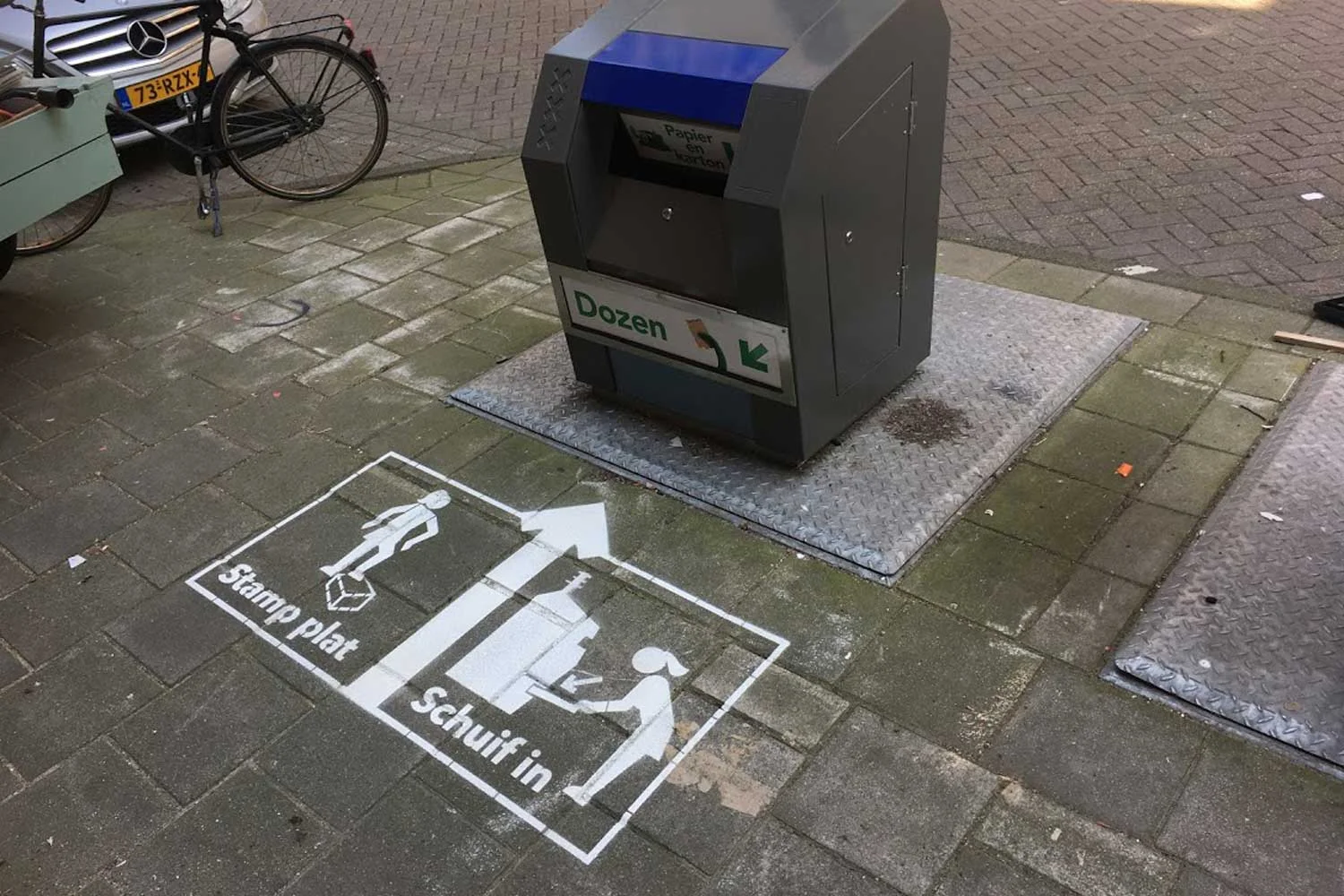 Stamp plat , schuif in campagne genereert publieksvoorlichting over aangepaste kartonnen containers. Download evaluatierapport hier