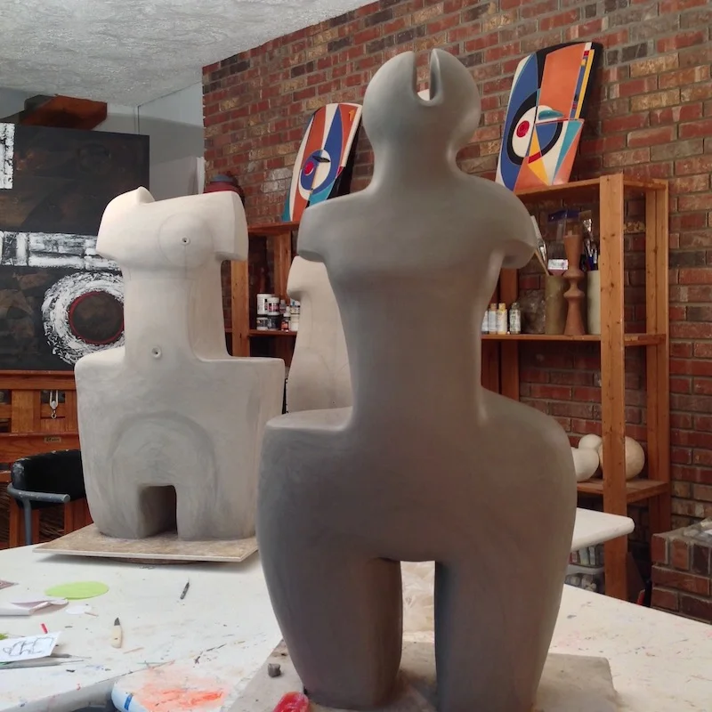  The sculpture in the background is almost ready (dry enough) to be bisque fired in my kiln. The sculpture in the   foreground required about 3 more weeks of drying time before bisque firing. 
