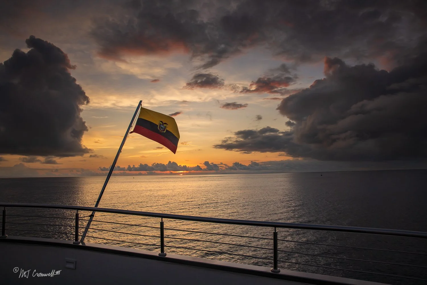 Ecuadorian Flag Flying off Stern of Our Boat, Solaris, at Sunset in Galapagos Islands