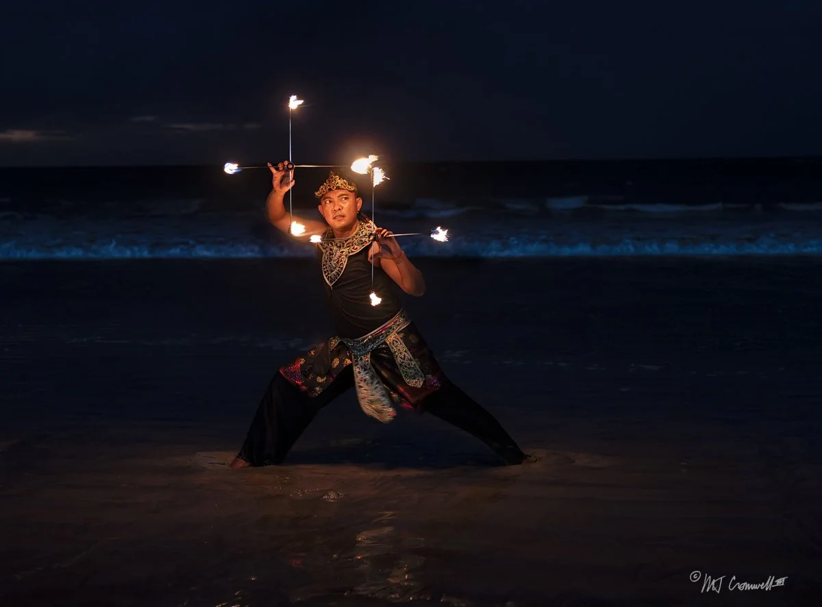 Fire Dancer on Jimbaran Beach on Windy Evening