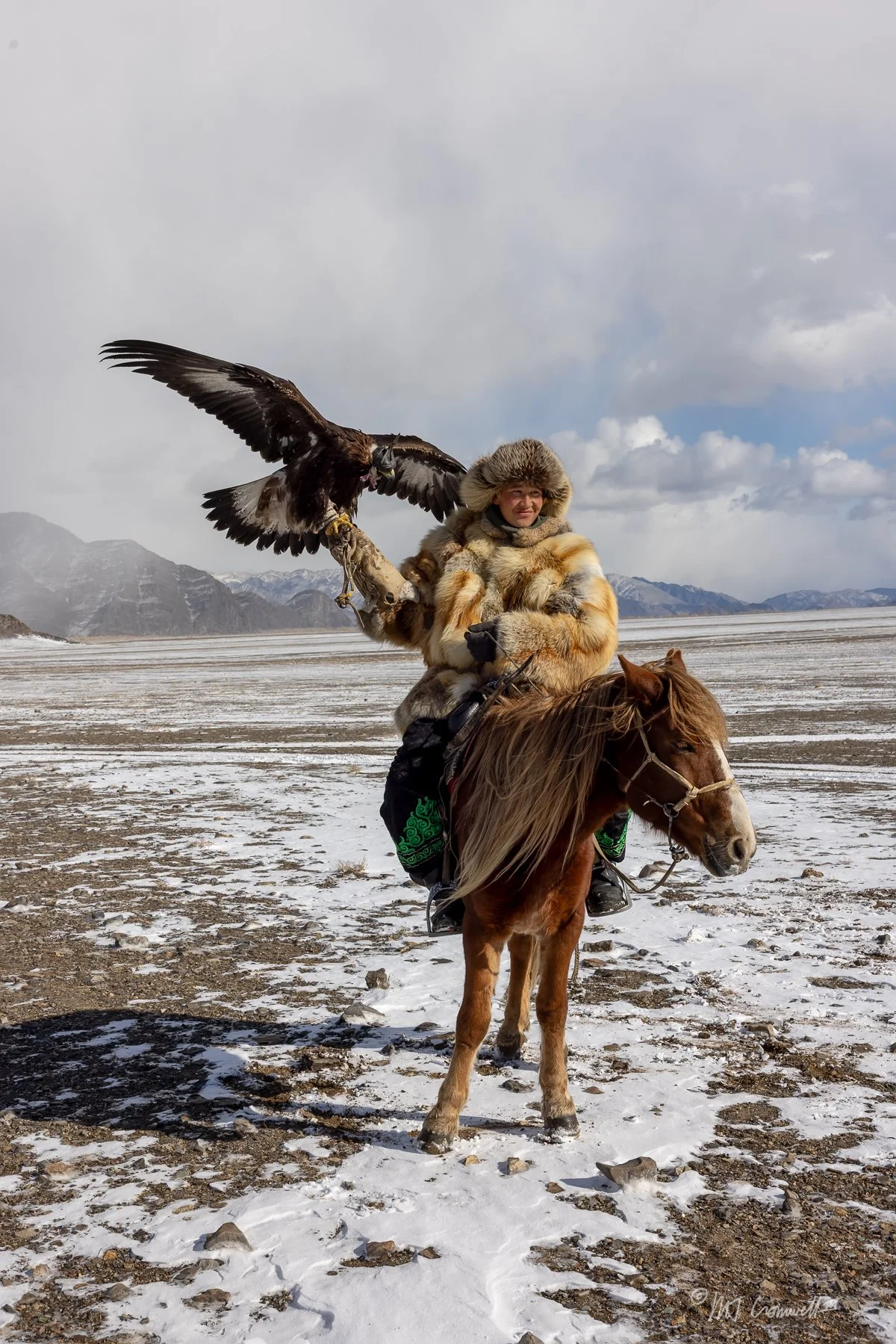 Eagle Huntress Posing With Her Eagle at Festival