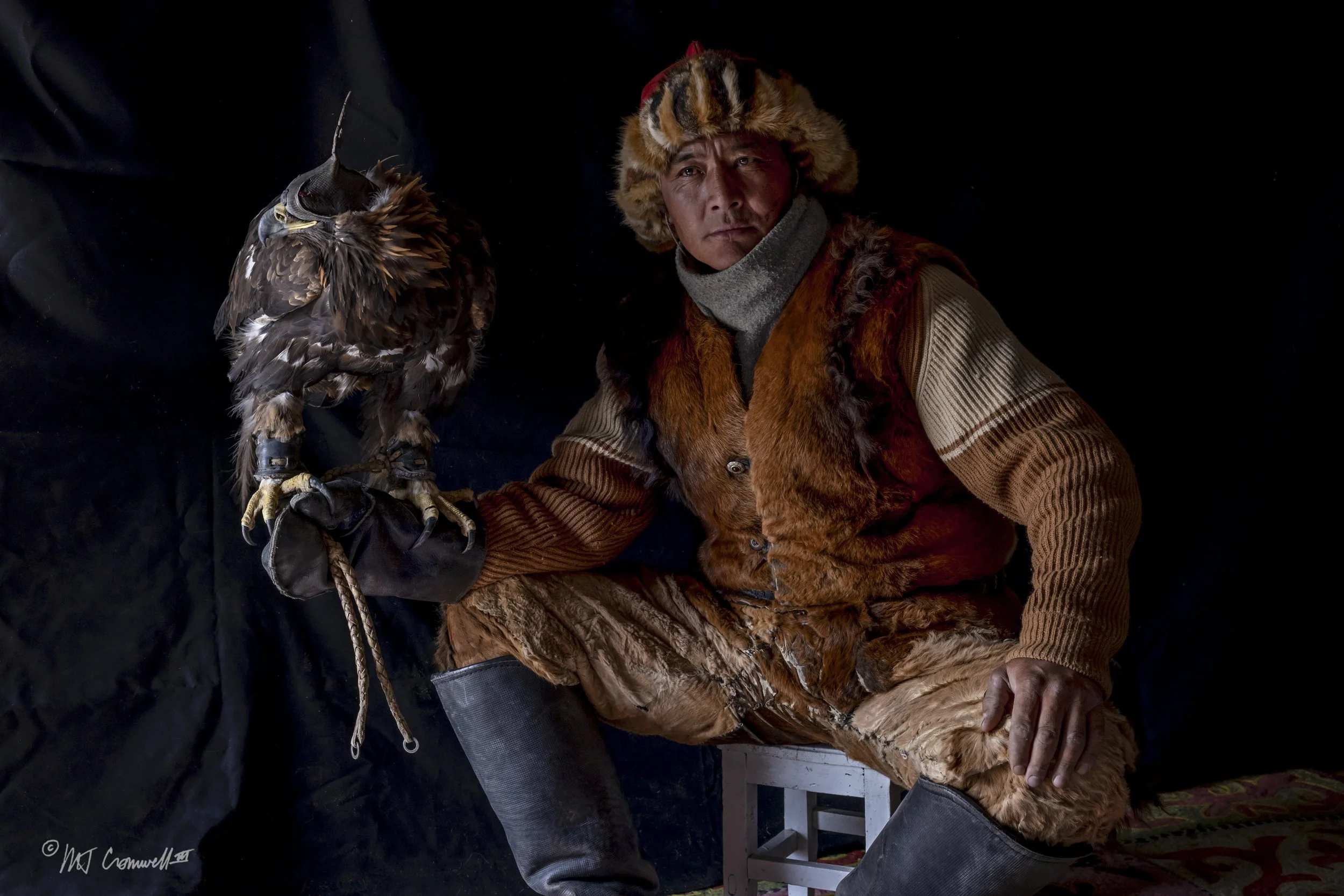 Portrait of Confident Eagle Hunter With his Bird