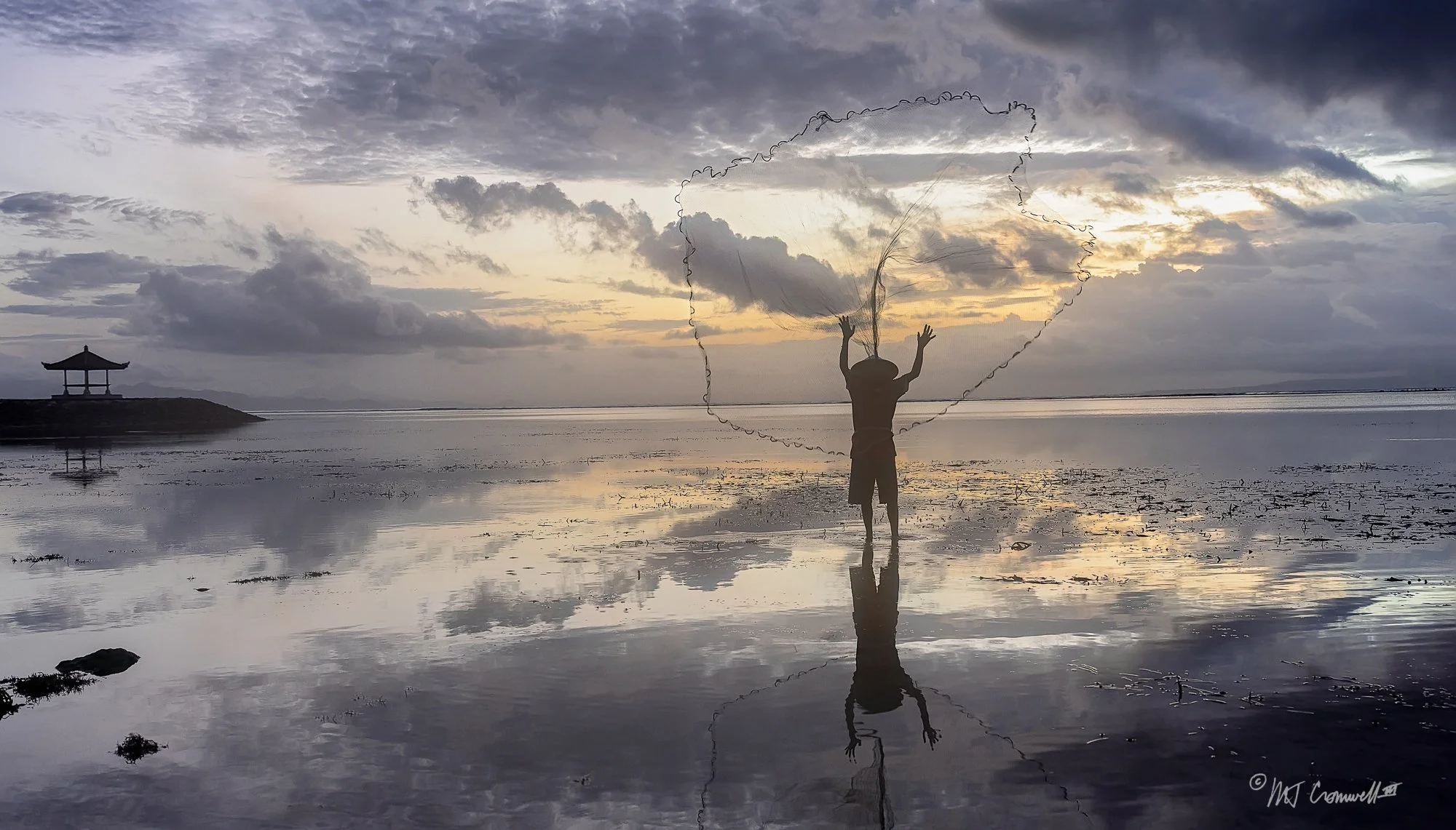Bali Fisherman Throwing His Net at Dawn
