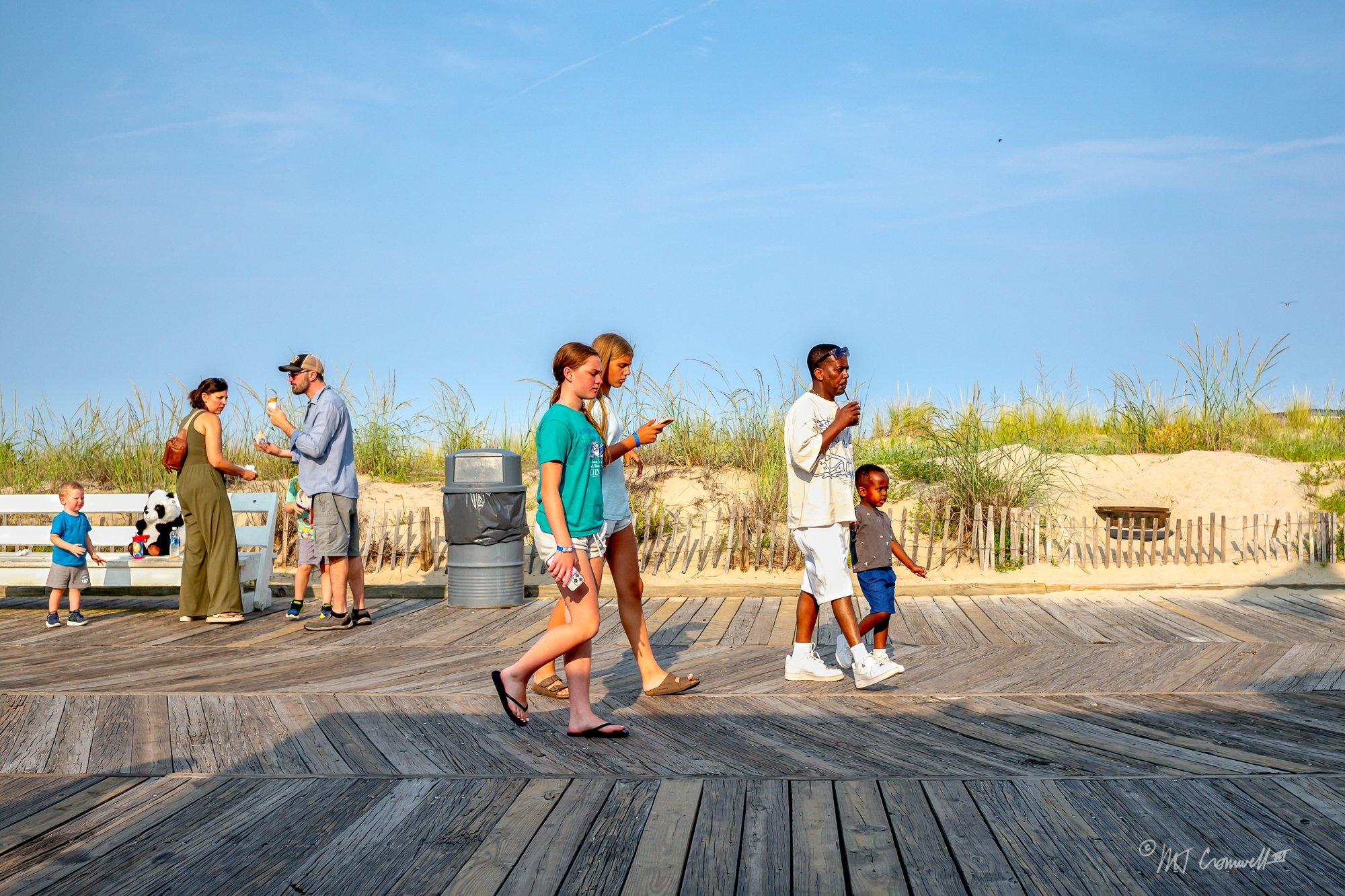 Strolling on the Boardwalk while looking at the phone