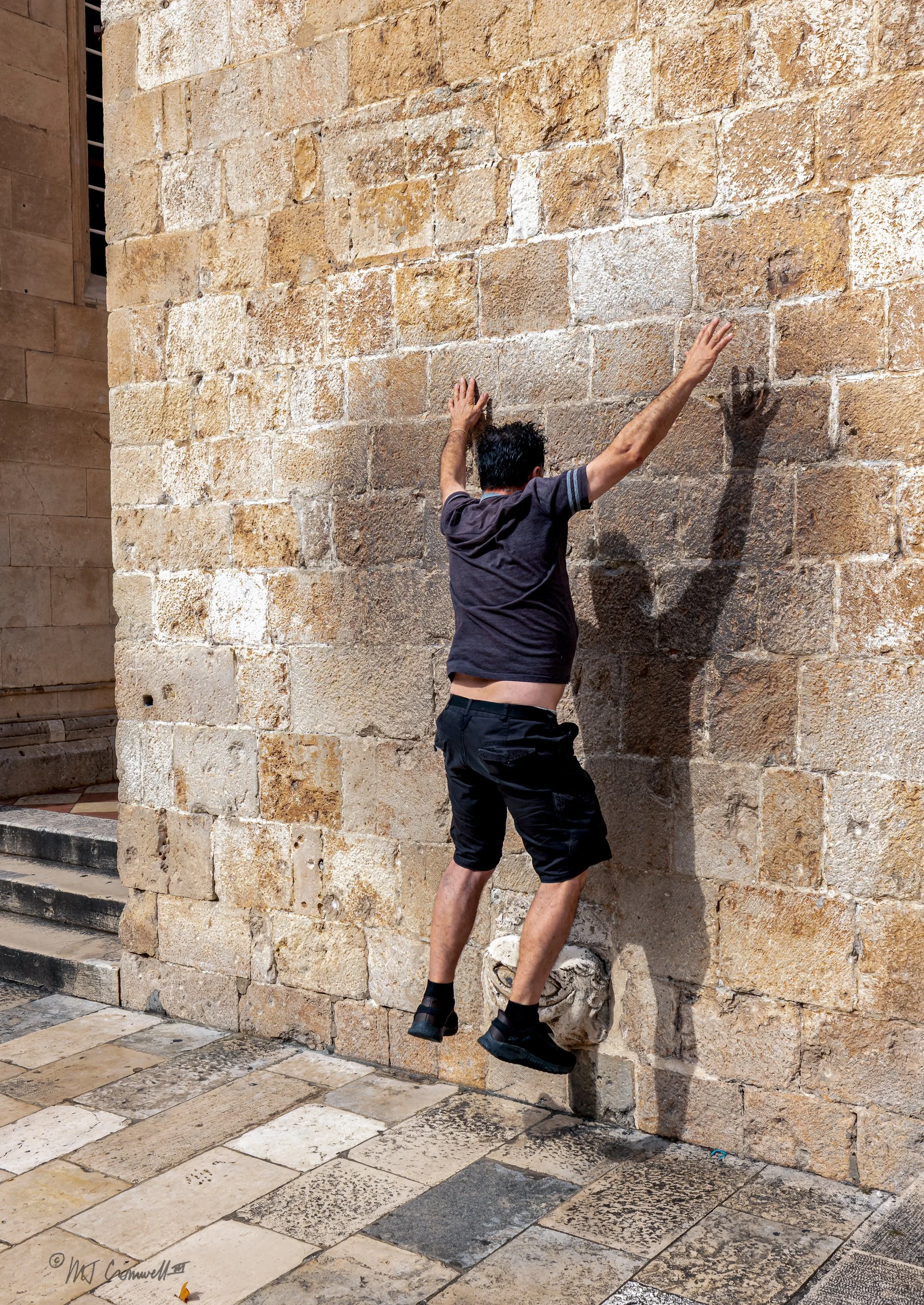 Visitor to Dubrovnik Falling off Balancing Stone