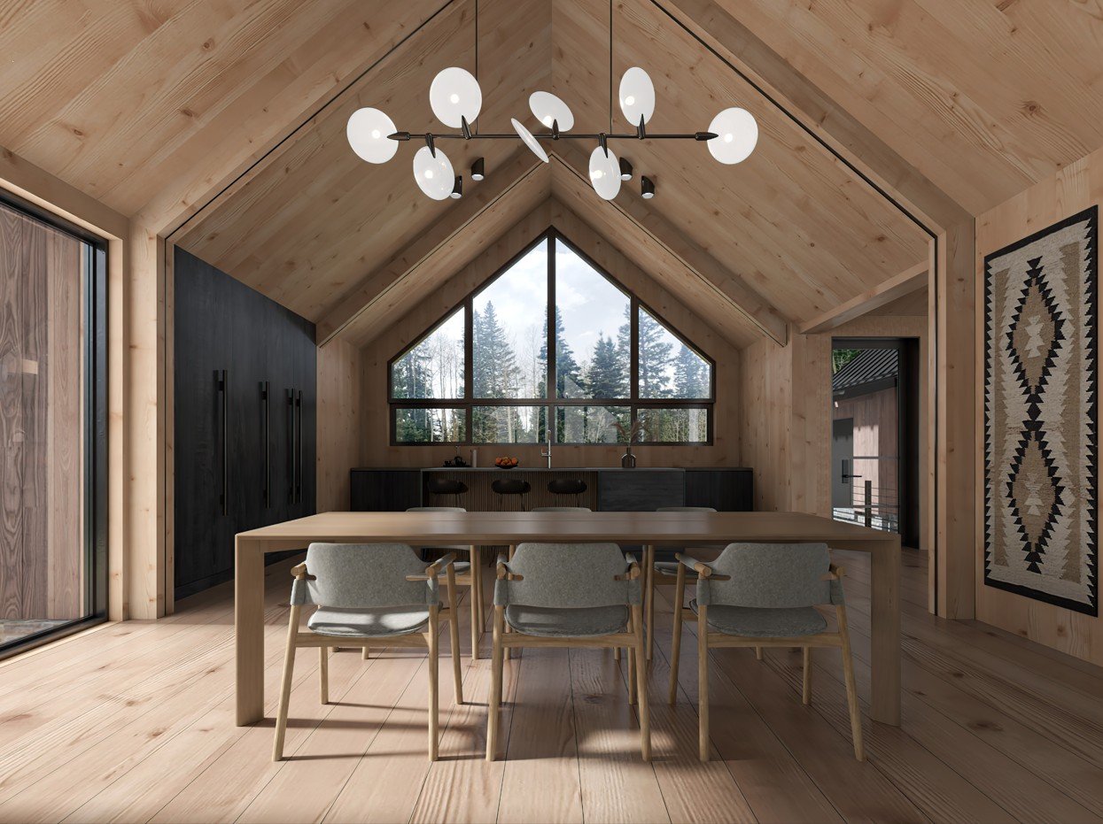 Modern dining area with light wood walls and ceiling, six chairs around a wooden table, large triangular window showing trees outside, black cabinetry, patterned rug on the wall, and a contemporary chandelier.
