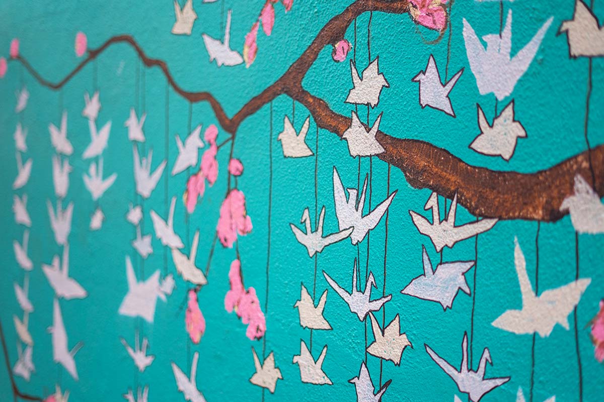 The paper cranes on the side of Graze on Spokane Street