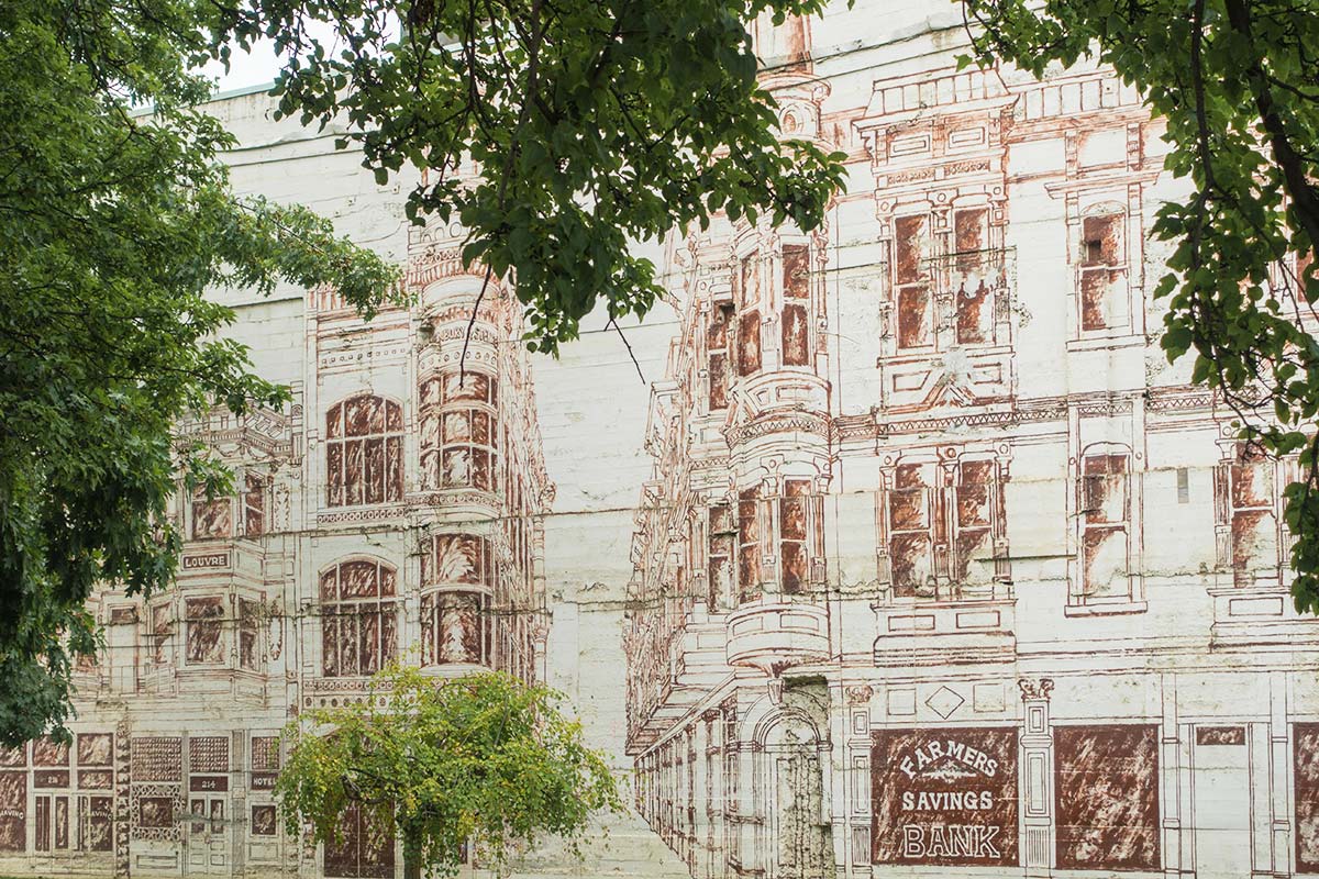 In Heritage Park is a painting of historic storefront facades