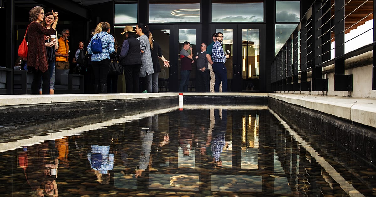 The pool of water on the Valdemar Estates deck is a central visual element.