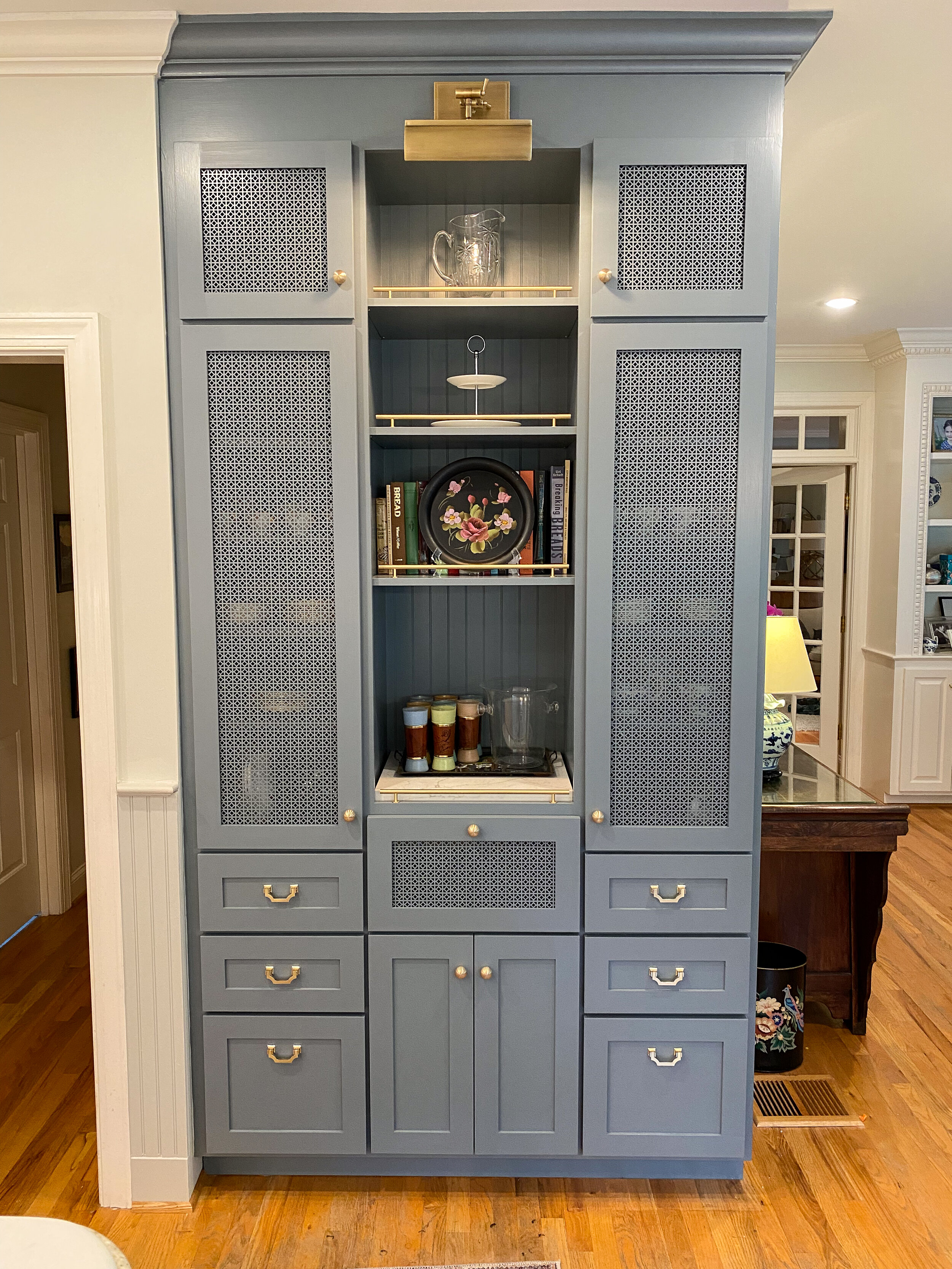  blue gray butlers pantry with mesh metal doors and brass hardware 