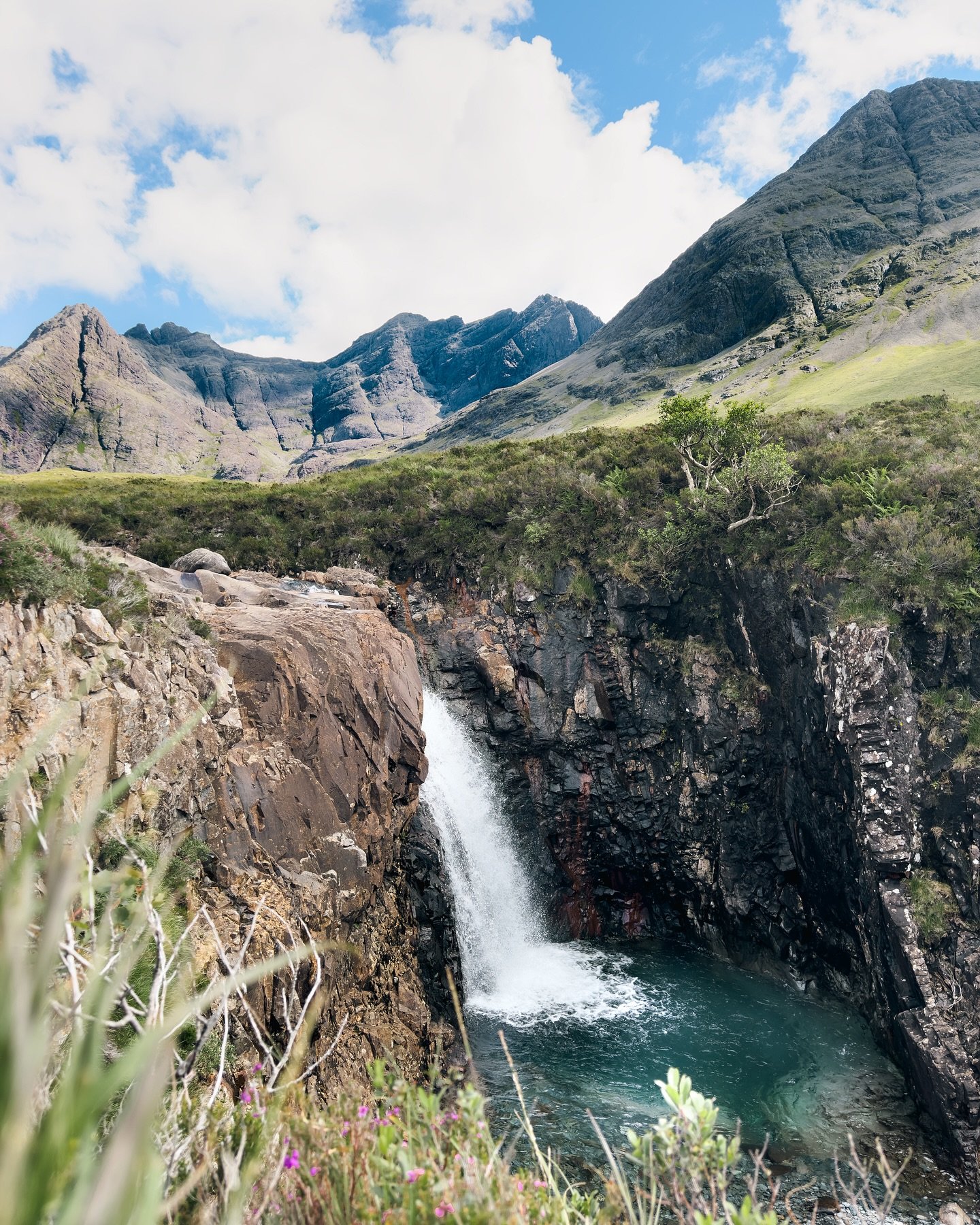 Calm your mind with the gentle flow of water and the peaceful embrace of the mountains.