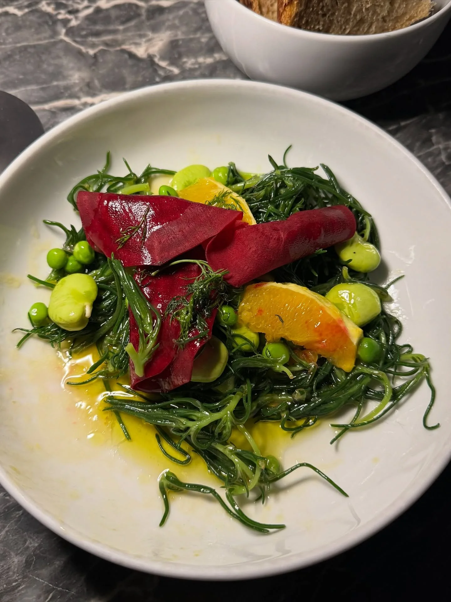 @pharaohathens ~ May 2024. Sometimes woodfire cooking leaves you thinking about the fruits of that hard labor for years to come. I think about this meal often. 

Monk&rsquo;s beard with fava beans, peas, beets, citrus.
Grilled meatballs with vegetabl