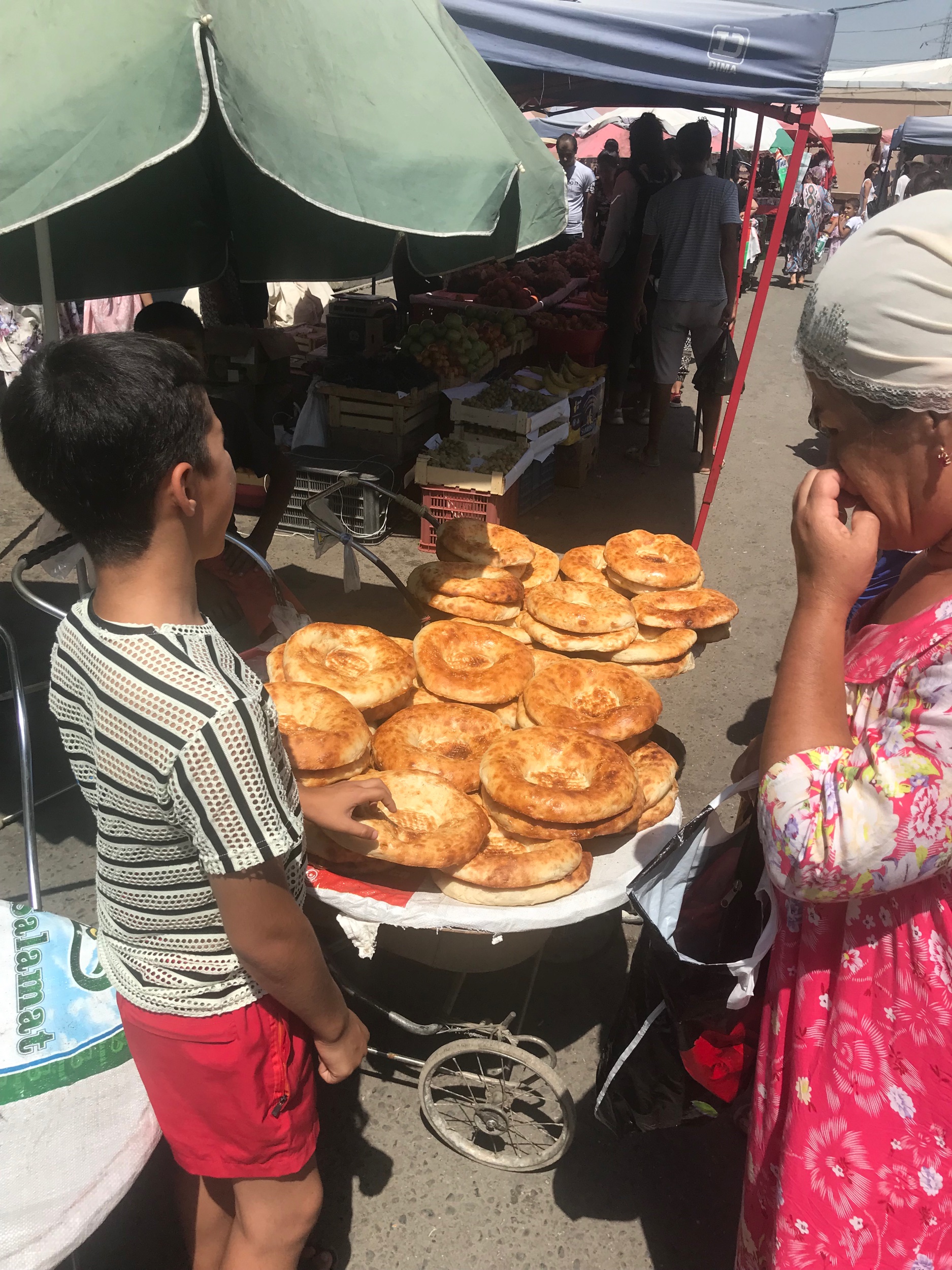 Uzbek bread sold at the bazaar - like a giant, airy bageljn