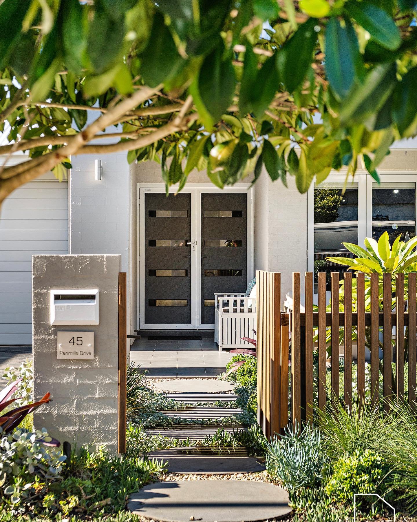 A simple front entry we did last year.  Rustic coastal native planting with hardwood timber fencing and natural basalt stepping stones