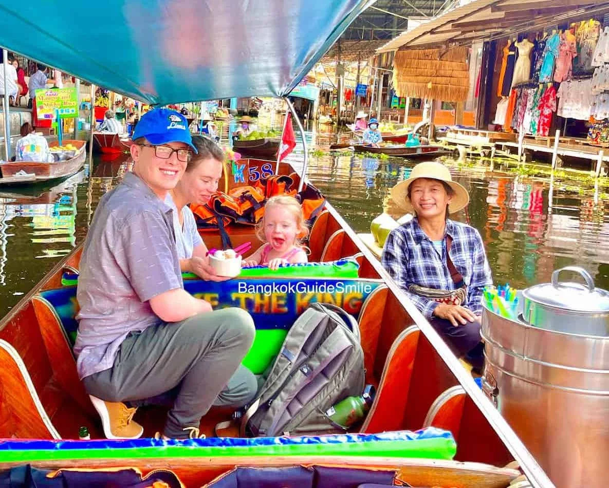 Female private guide shows local foods fruits at Floating Market Thailand on tour from Bangkok