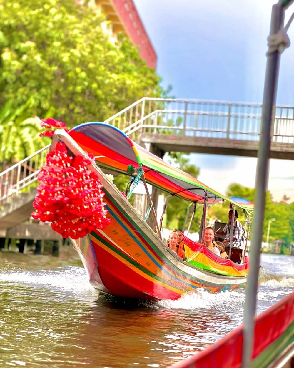 Tourists enjoy seeing local Thai living along canal tour in Bangkok with private guide