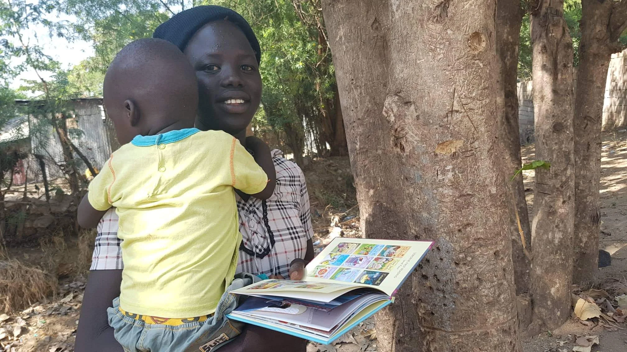 A family receives their first book in Juba, South Sudan.