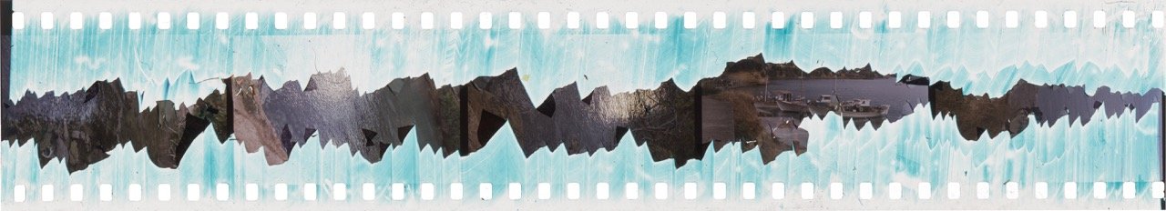 Sculpted analog 35mm color positive film showing carved emulsion. Original 35mm film strip uncut