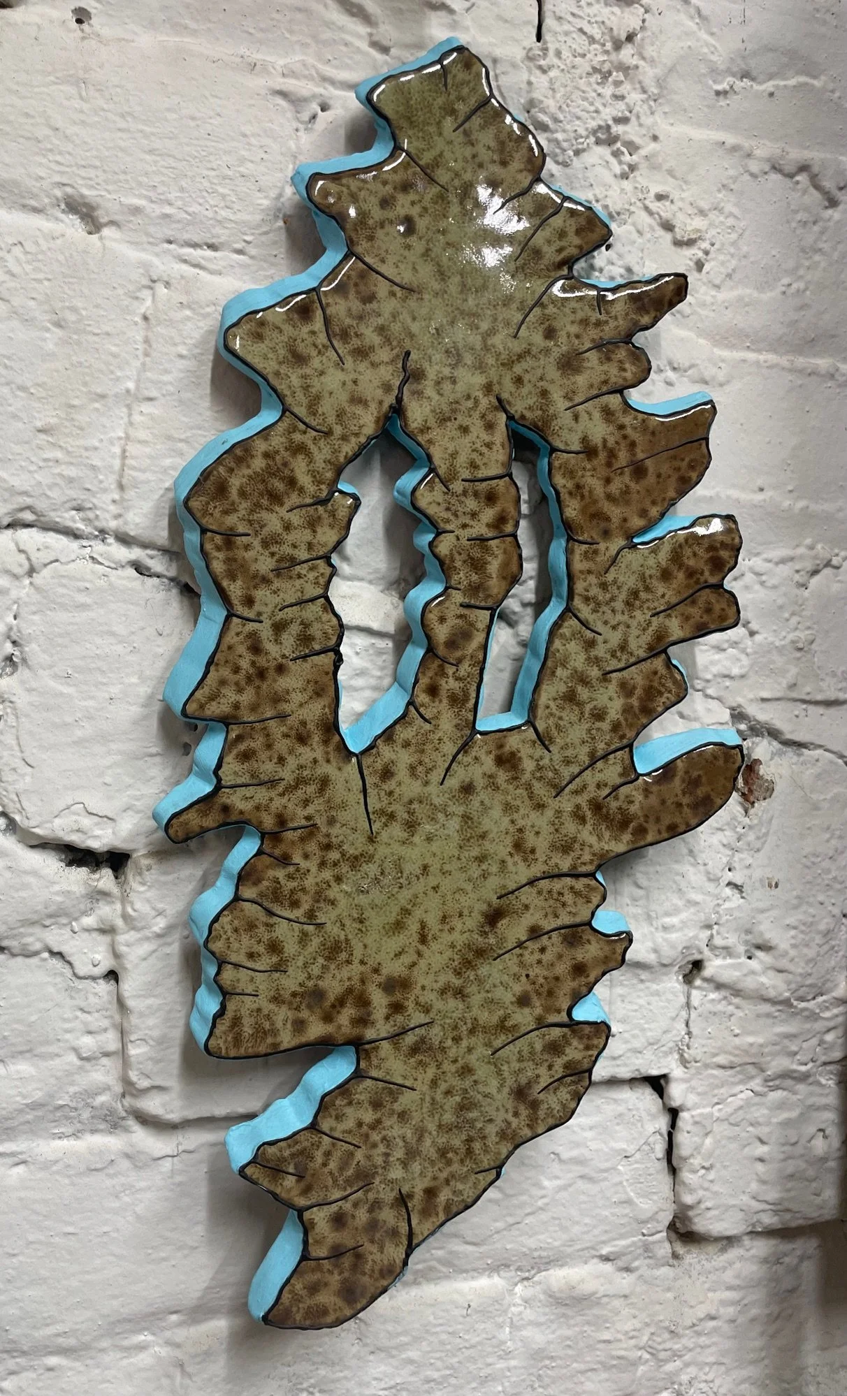 J.Ivcevich_Shredface(Earth_Blue)_13x7x1_2019_glazed+ceramic+polymer+relief_$850_unique (1).jpg