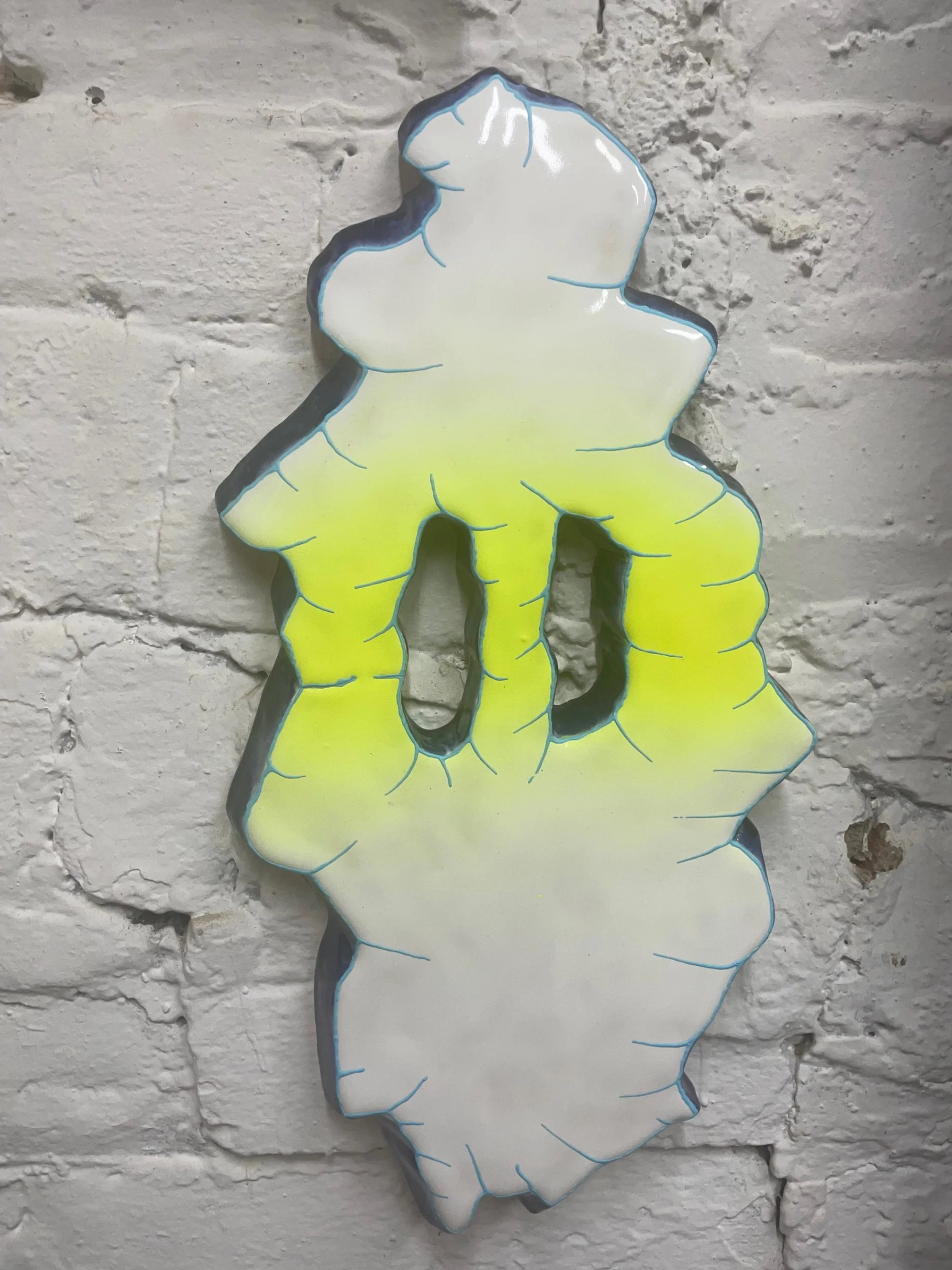 J.+Ivcevich_Shredface(Blue+Lime)_12x8x1_2025_glazed+ceramic+polymer+relief_$850_unique (1).jpg