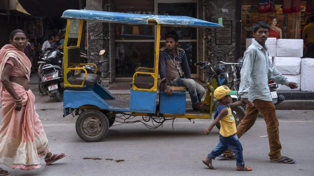 An electric rickshaw, locally known as toto, on the streets of Varanasi..jpg
