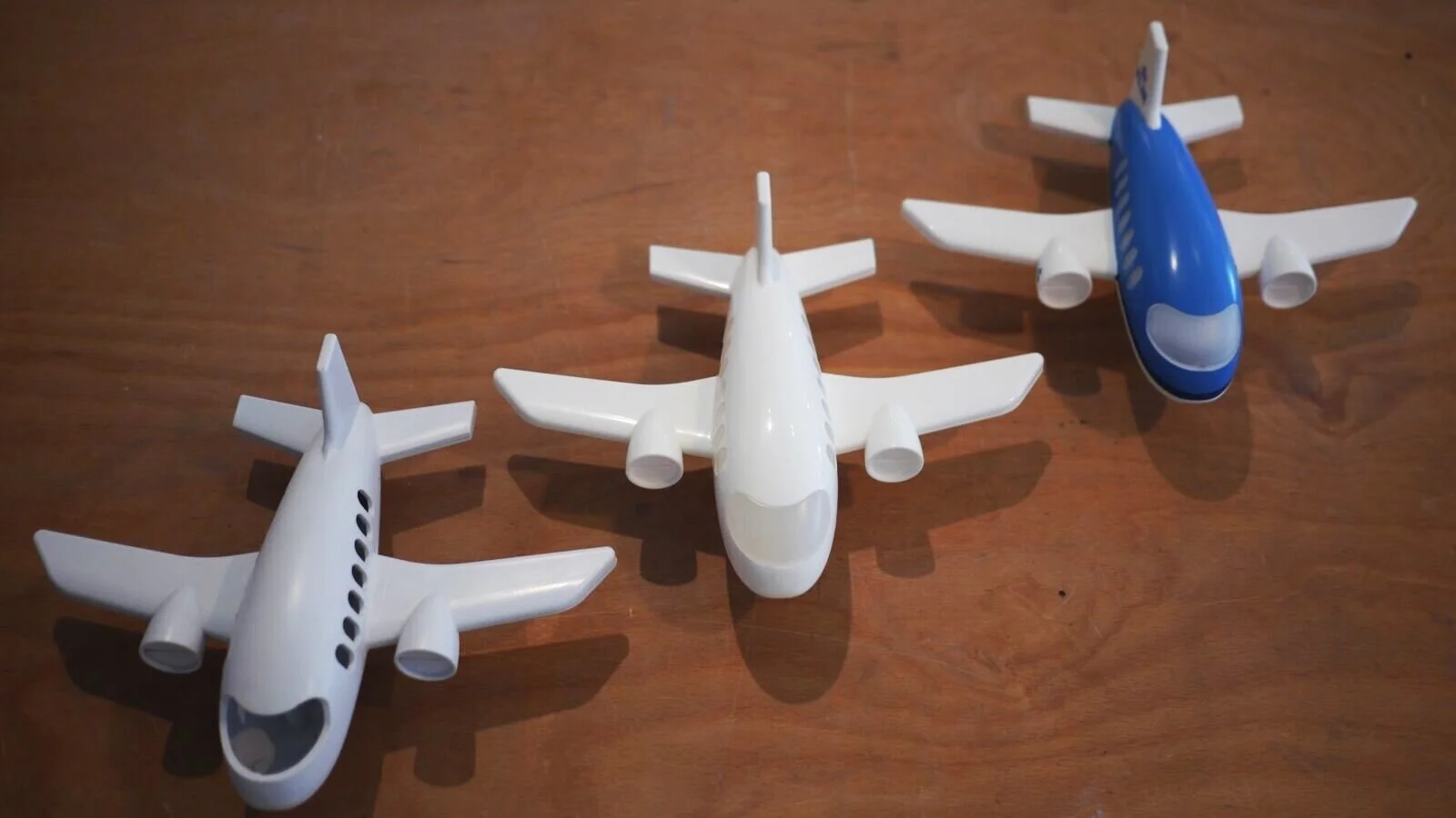 Left to right: mould test, base plastic with no detailing, fully detailed/branded product