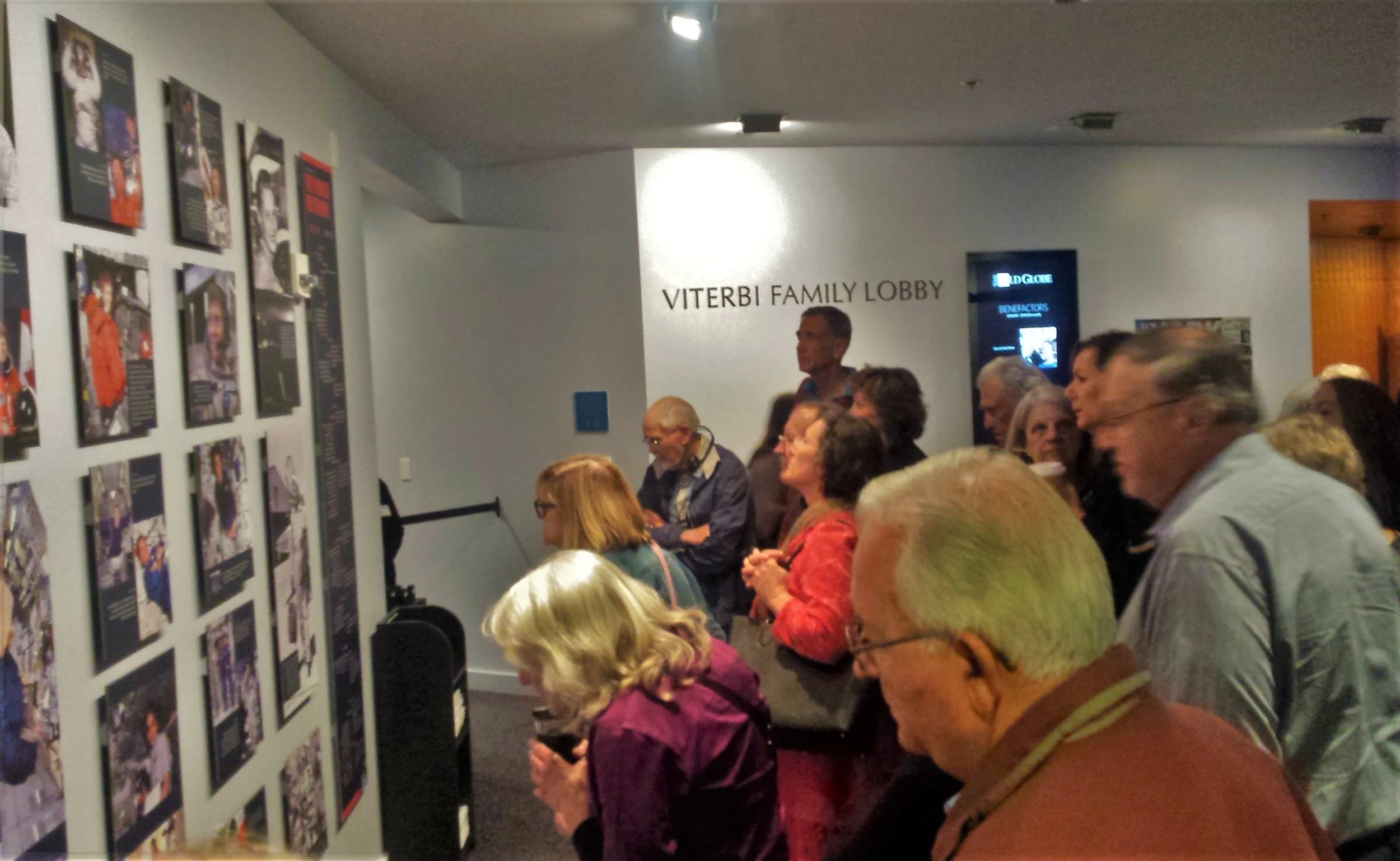 Theater patrons looking at the exhibition I curated.